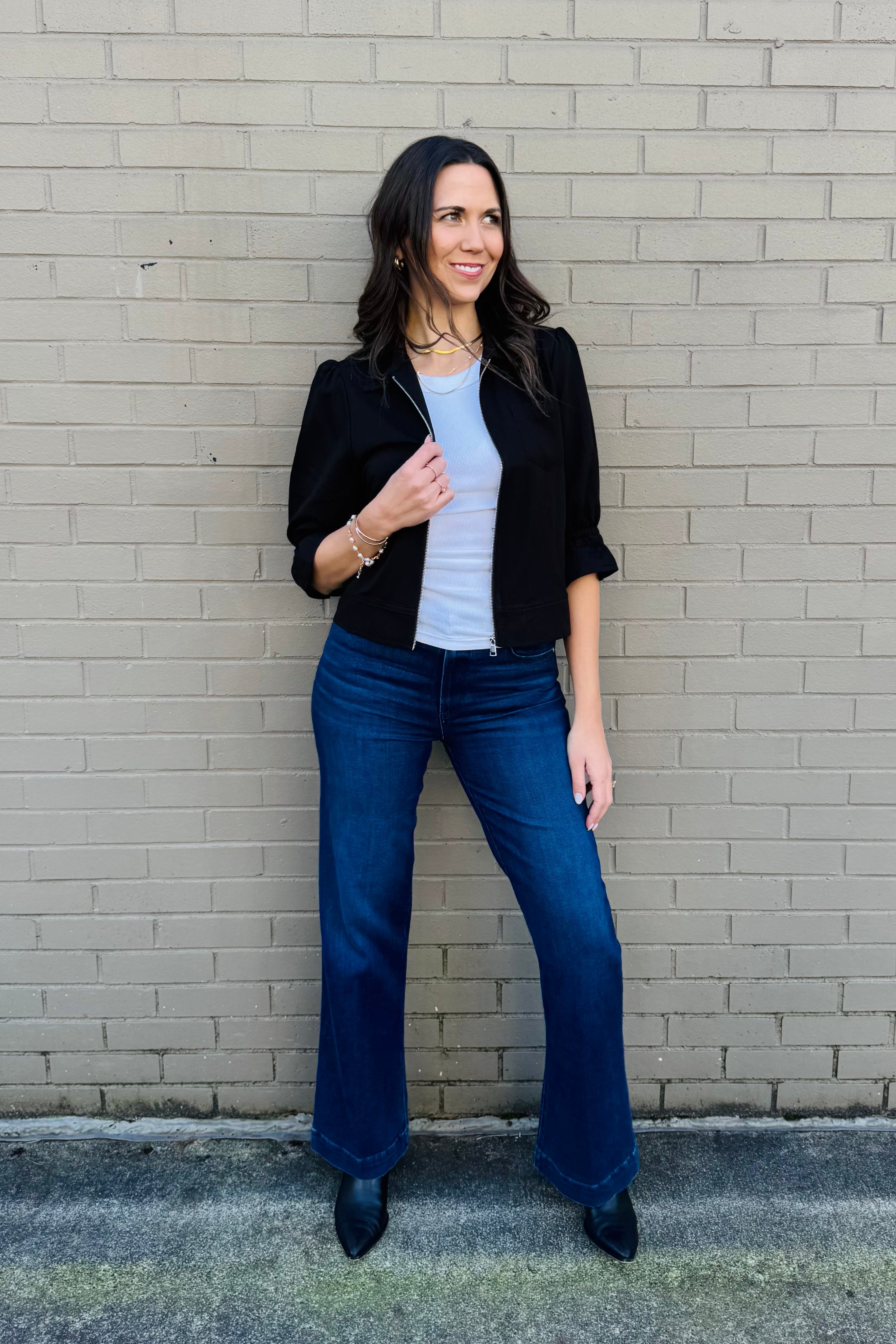 This lightweight 3/4 sleeve zip jacket is great for a easy layering piece. Pair it with denim or shorts or zip it up to wear as a shirt.