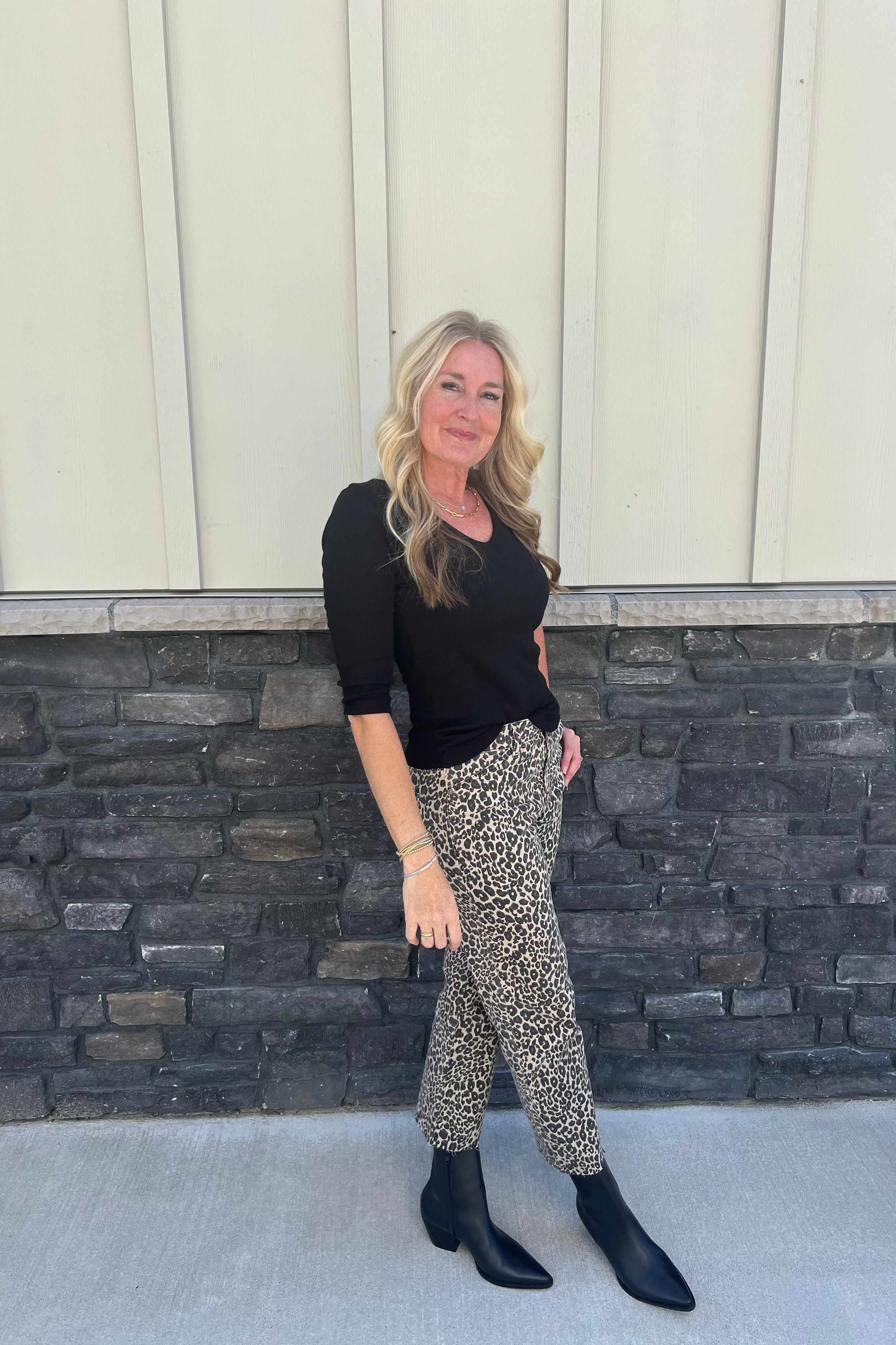 Crafted in our iconic shine fabric, the subtle sheen makes this top a chic day-to-night style. It features a delicate v-neckline and ¾ sleeves. The front is double-layered for a more weighty feel. Wear yours with a midi skirt or pants.