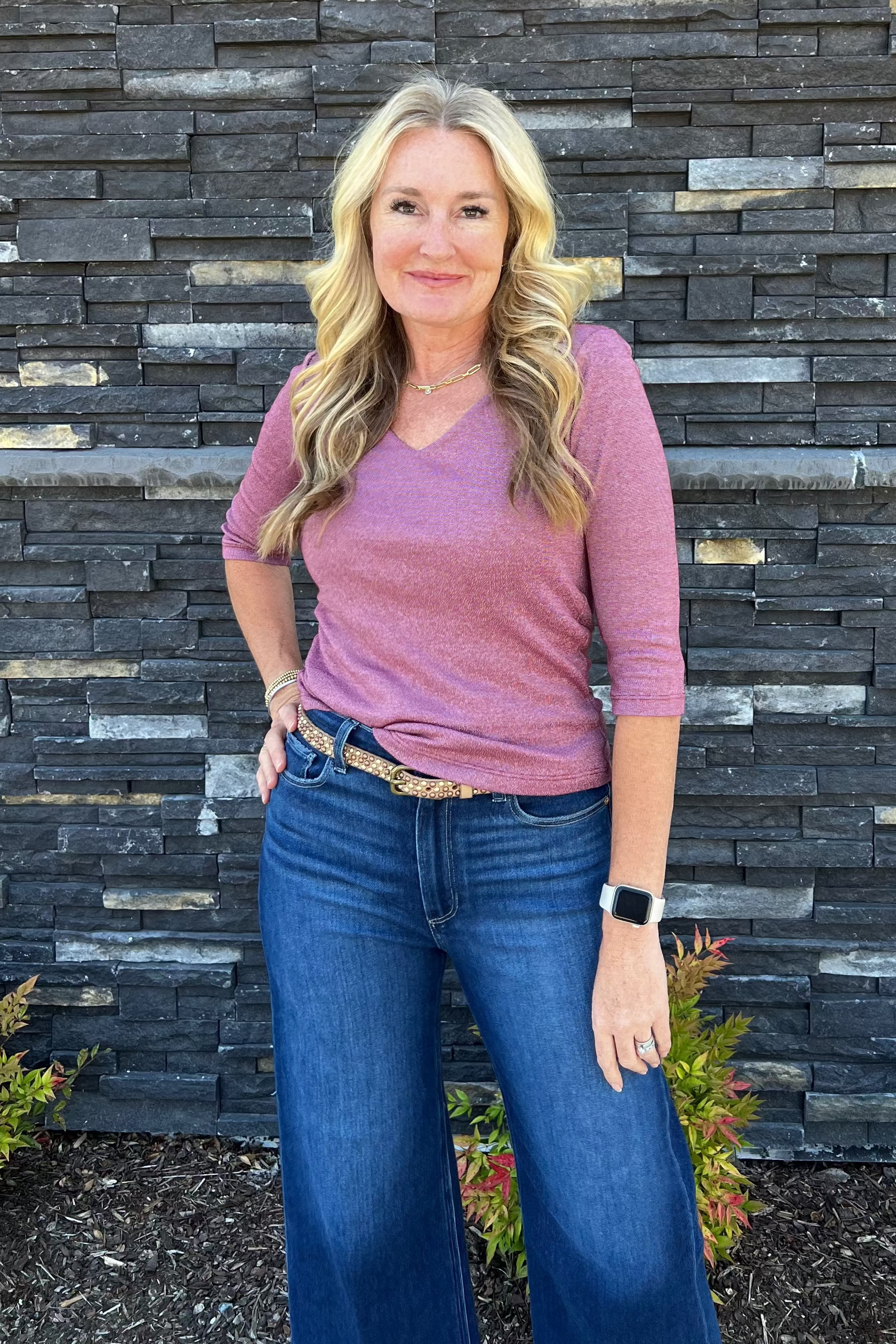 Crafted in our iconic shine fabric, the subtle sheen makes this top a chic day-to-night style. It features a delicate v-neckline and ¾ sleeves. The front is double-layered for a more weighty feel. Wear yours with a midi skirt or pants.