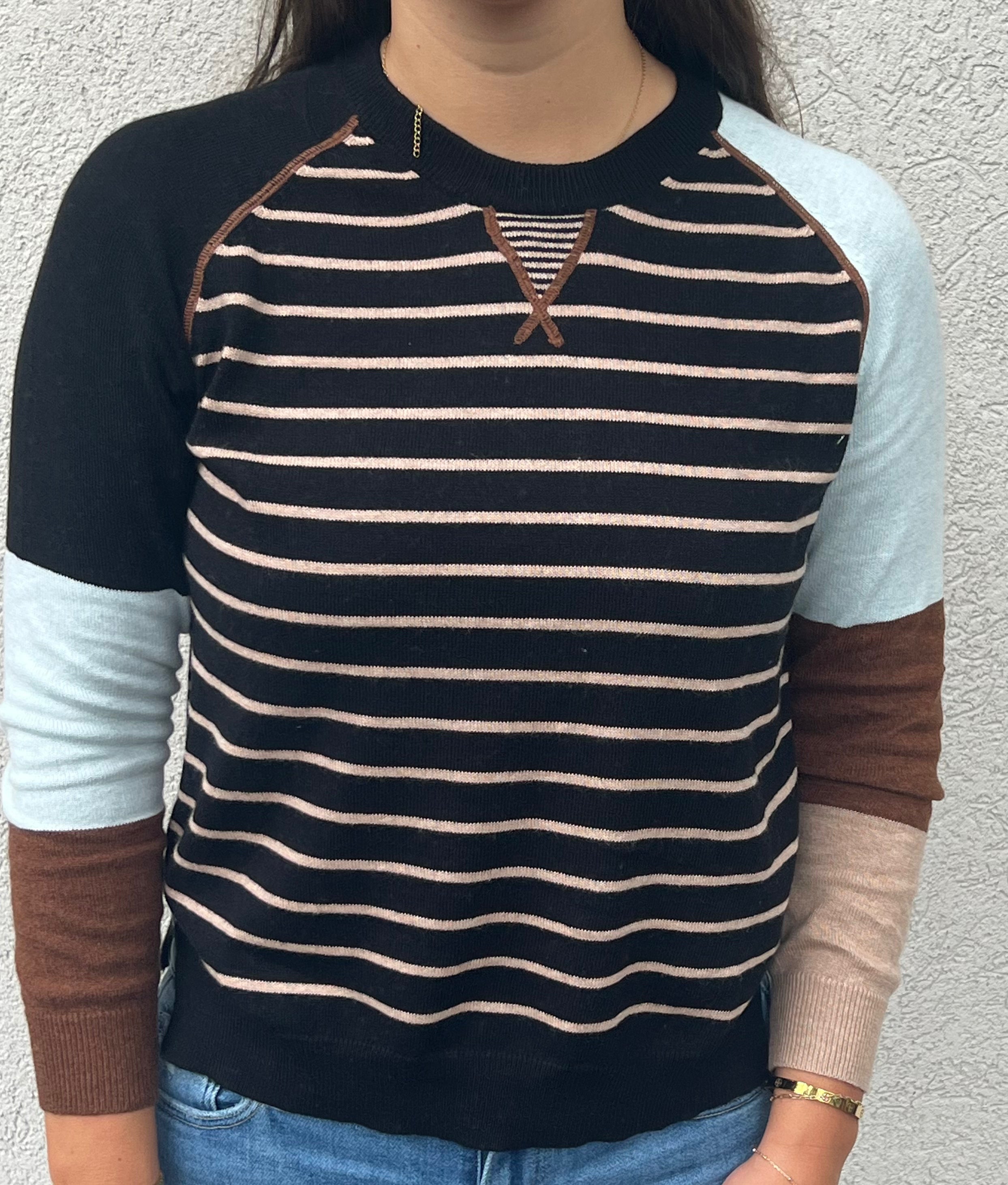 This Breton Sweater from Zaket & Plover features a refined stripe design with thin stripes on the body and bold color blocks on the sleeves, combining subtlety and statement. Crafted from a soft blend of 95% cotton and 5% cashmere, it offers both comfort and durability.