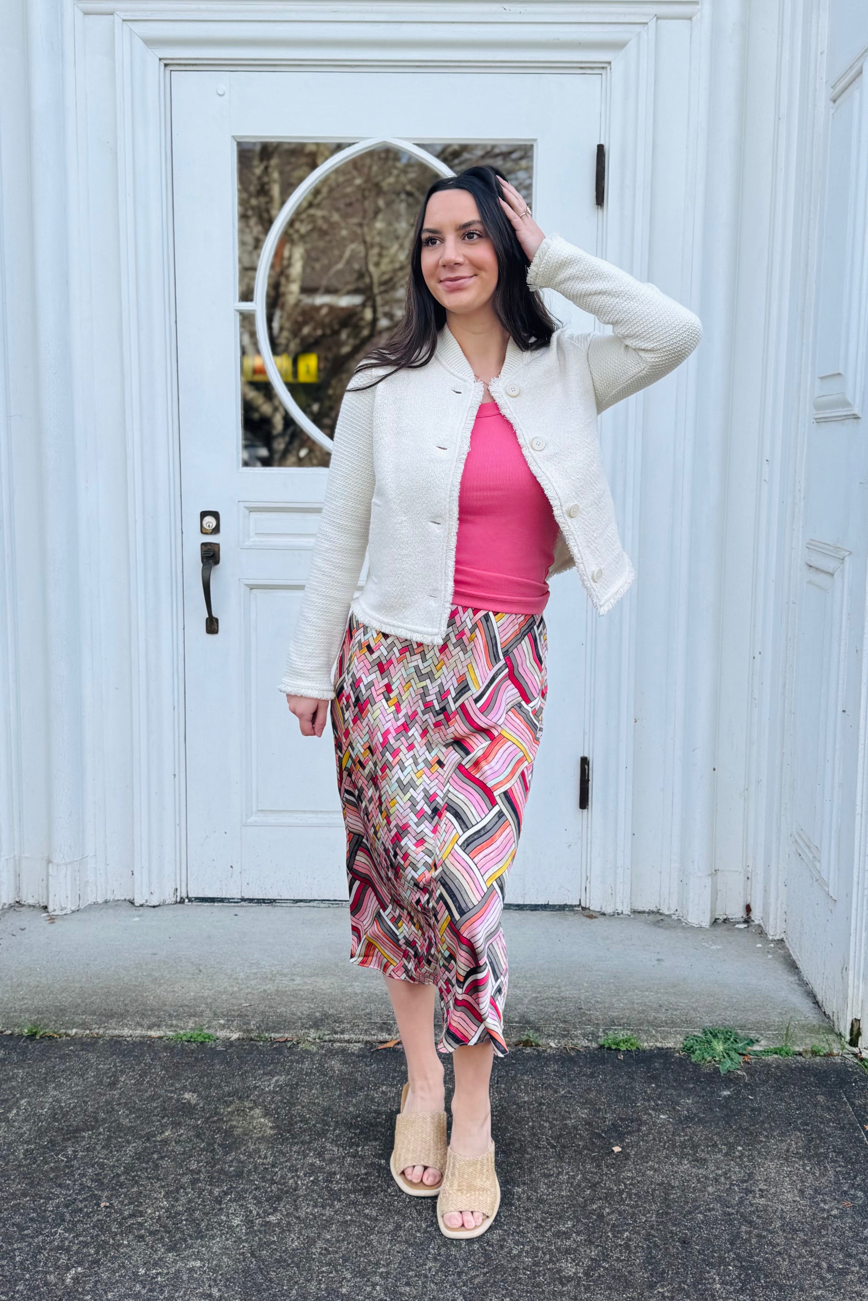 We love this woven skirt detailed with so many beautiful spring colors. Very Arktana vibes. spring colors pair perfectly with fun pops of colors and sandals.