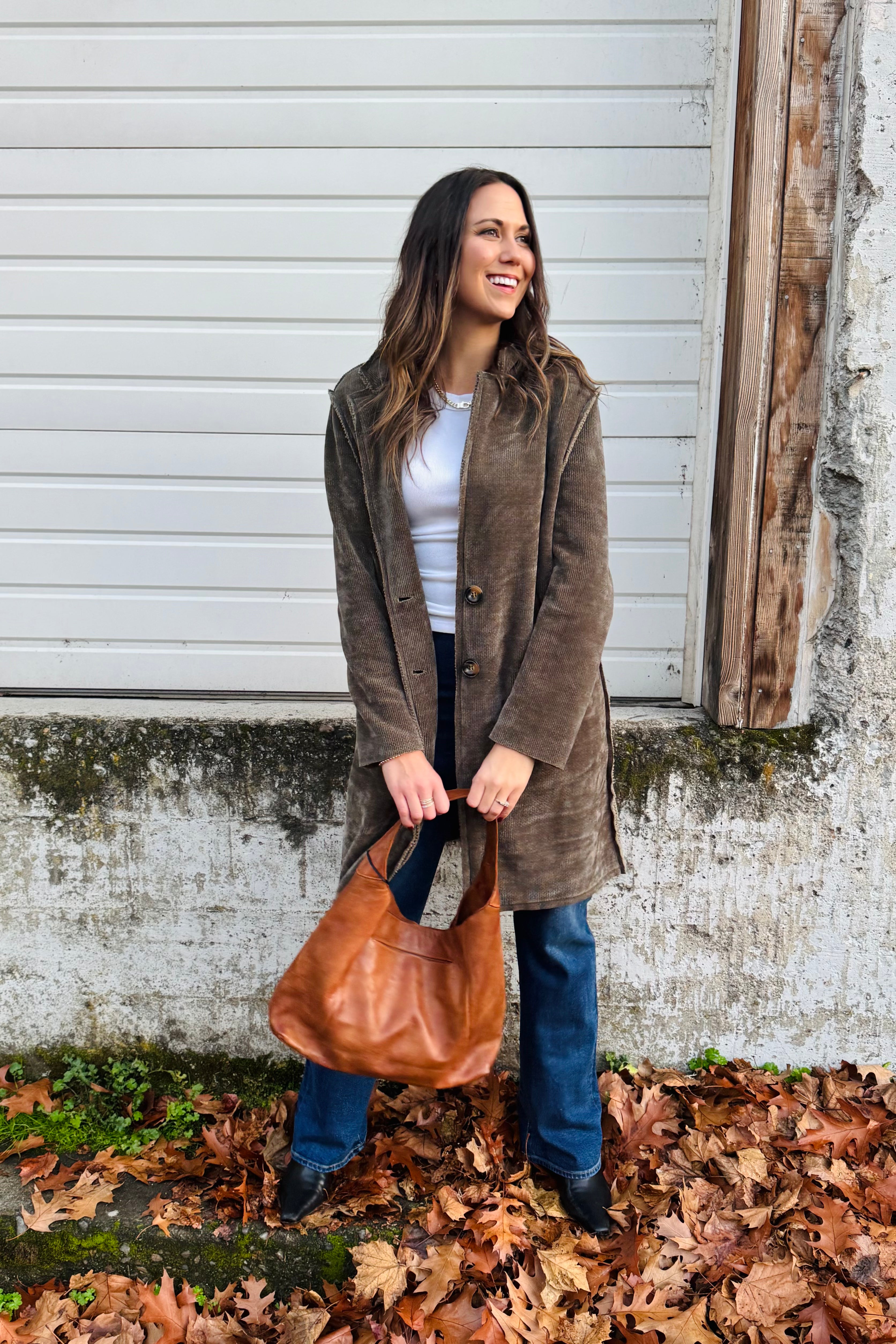 Crafted from a durable cotton blend, this mid-length jacket boasts a timeless design that adds a cozy layer to any outfit. Stay warm and comfortable with this cozy jacket's added protection against the cold. Made in Italy