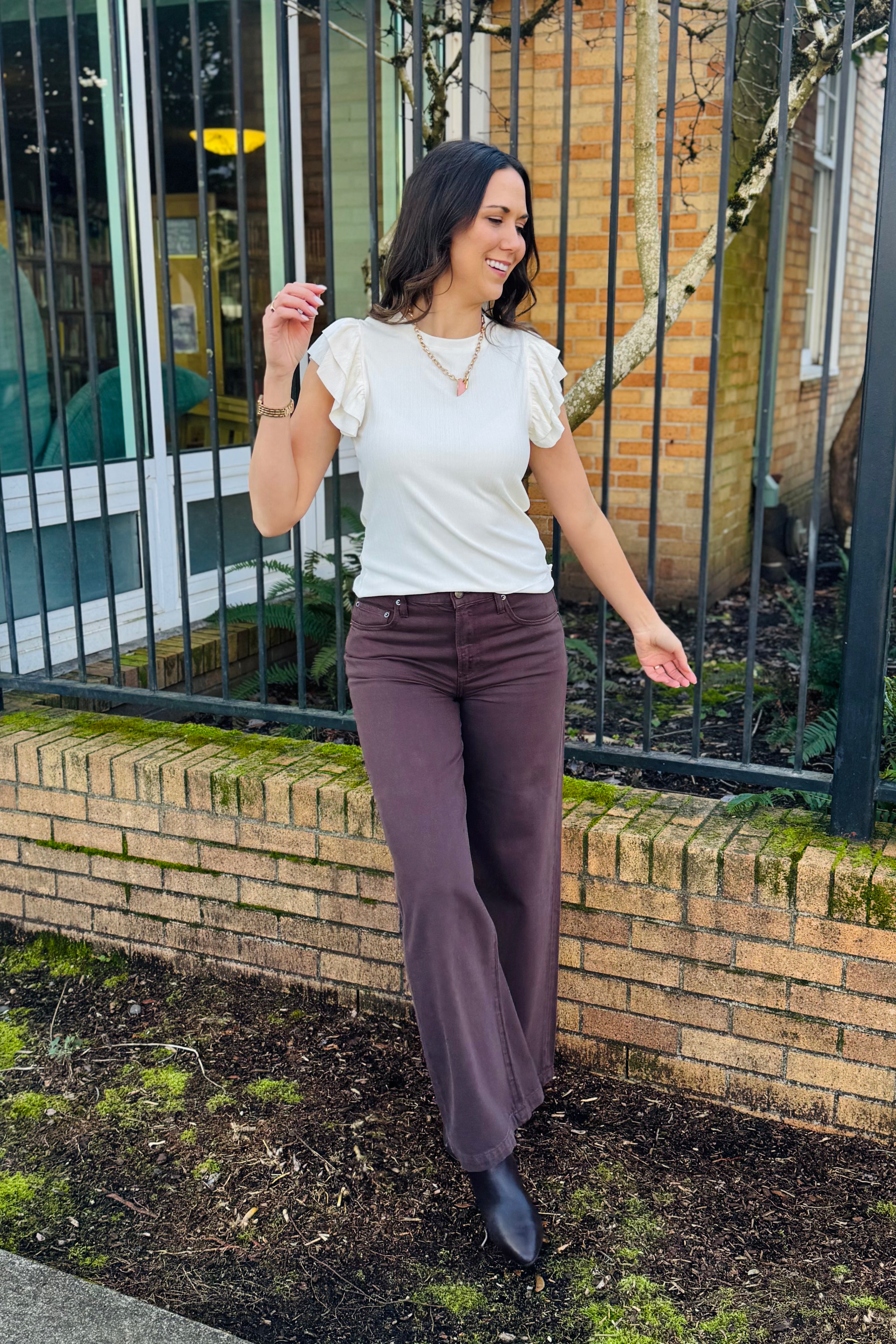 This is sch a beautiful blouse with a little texture so its not a basic white tee. The sleeves are so fun and flirty with the ruffle sleeve. So cute to wear all season and pair with your favorite denim.