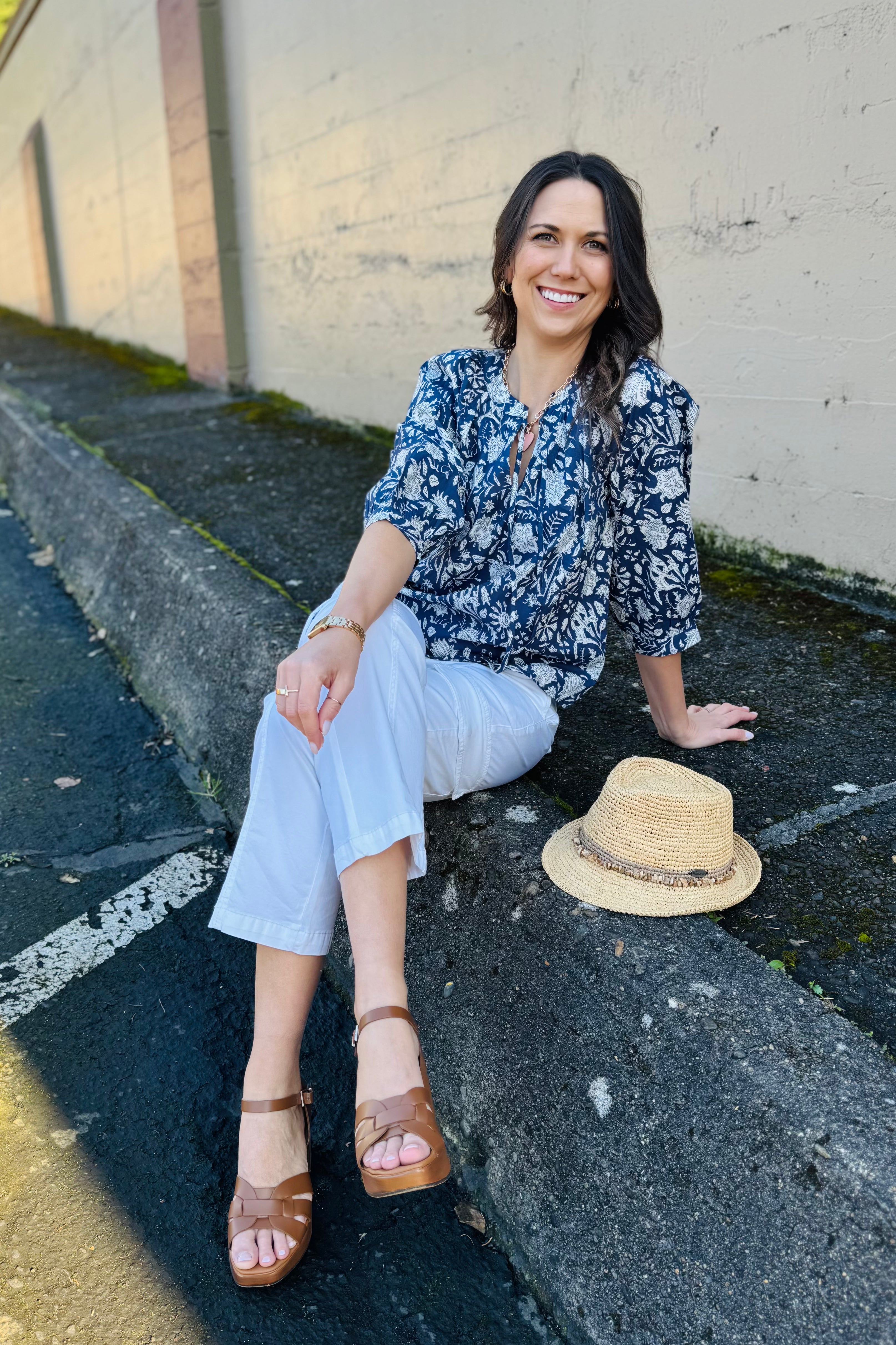 Wear this blouse to brunch, girls day, or just out an about. Puff sleeve, ruched top, and a cute tie on the neckline. The perfect girly touches to make you feel beautiful inside and out. We styled this with a white pant but it would look just as cute with a denim or flowy skirt!