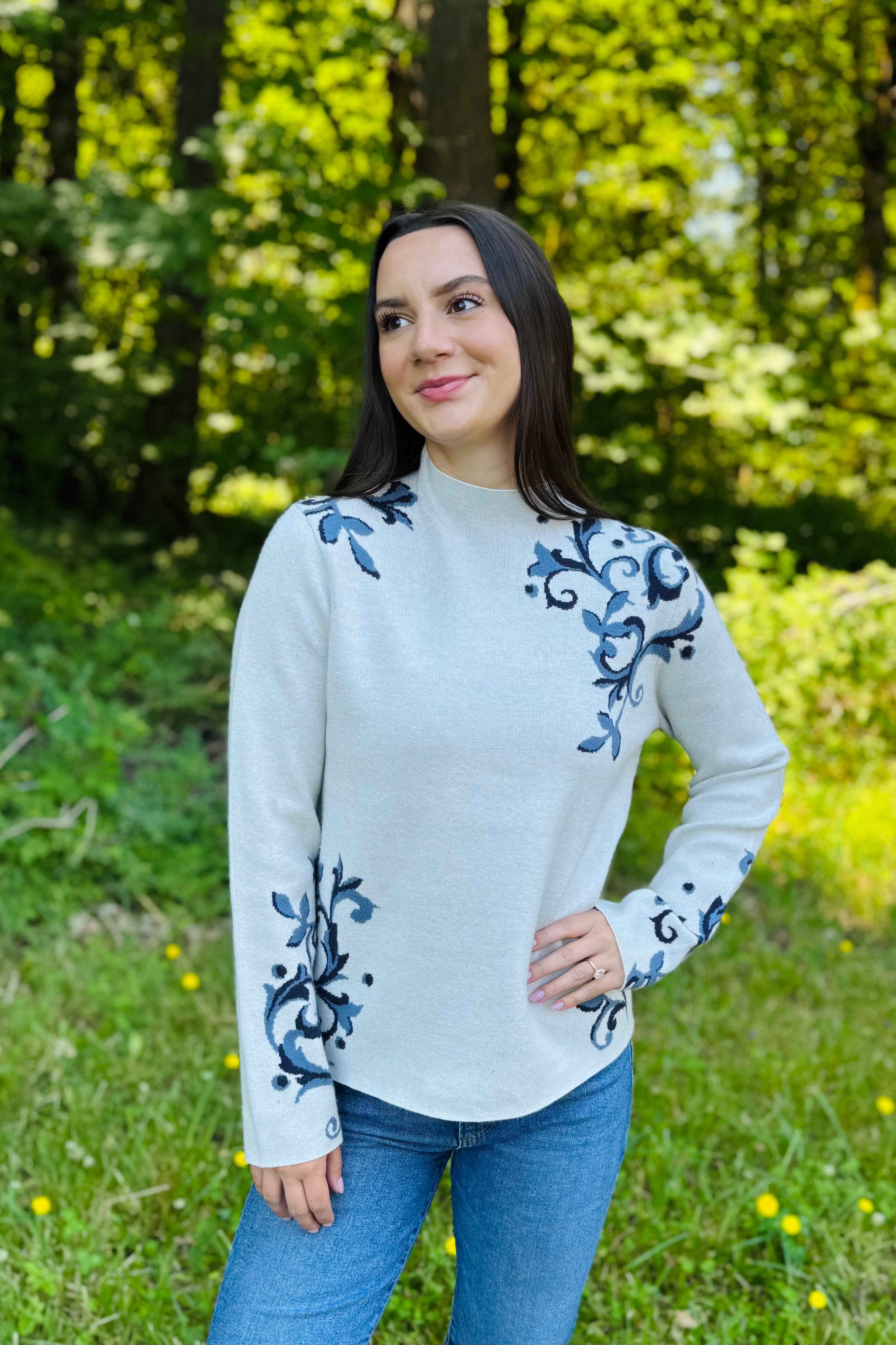 Add a fun pop of color to your fall wardrobe with this cozy floral jacquard sweater. The rich wine hue and modern funnel neck make it easy to dress up or down—pair it with your favorite denim and boots for an effortless everyday look or black pants for an elevated outfit. Soft, cozy, and perfect for cooler days.