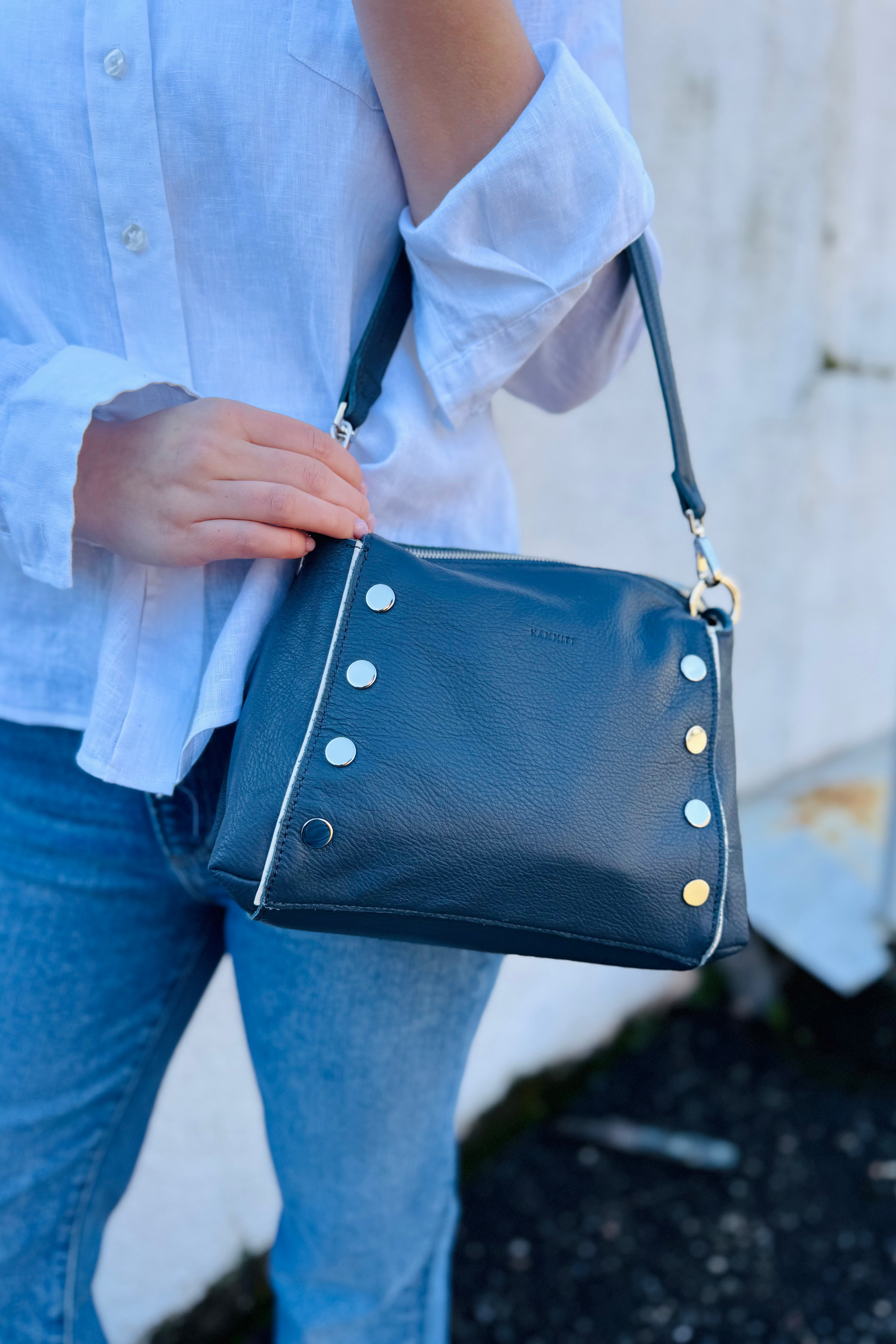Arktana customers love the hammitt bags based out of LA. This one is a total costal vibe with that classic navy blue and of course that Hammitt hint of red on the back zipper. This is a perfect medium sized bag if you don't want something to small or big.