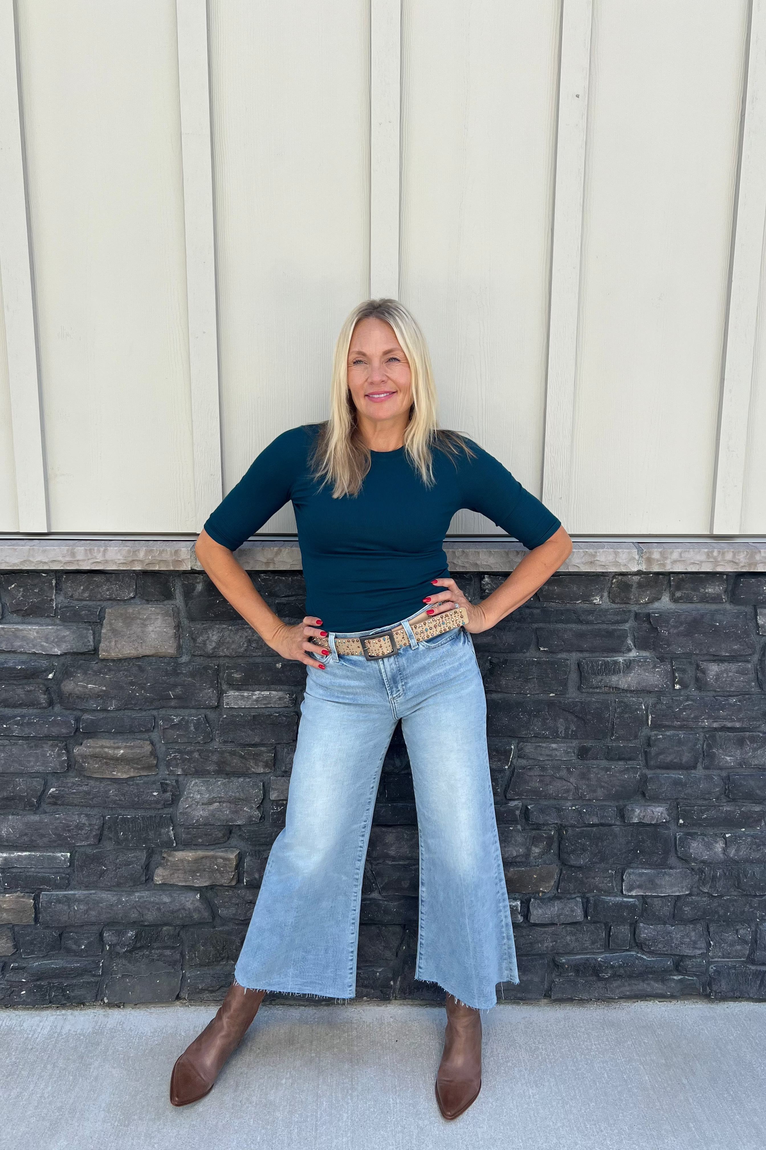 The Maeve Crop Tee in white features a fitted silhouette with elbow-length sleeves, crafted from sustainable eco 2x1 rib fabric made of 97% Ecovera Viscose. This breathable, machine-washable top offers both comfort and style, making it an essential piece for your spring wardrobe.