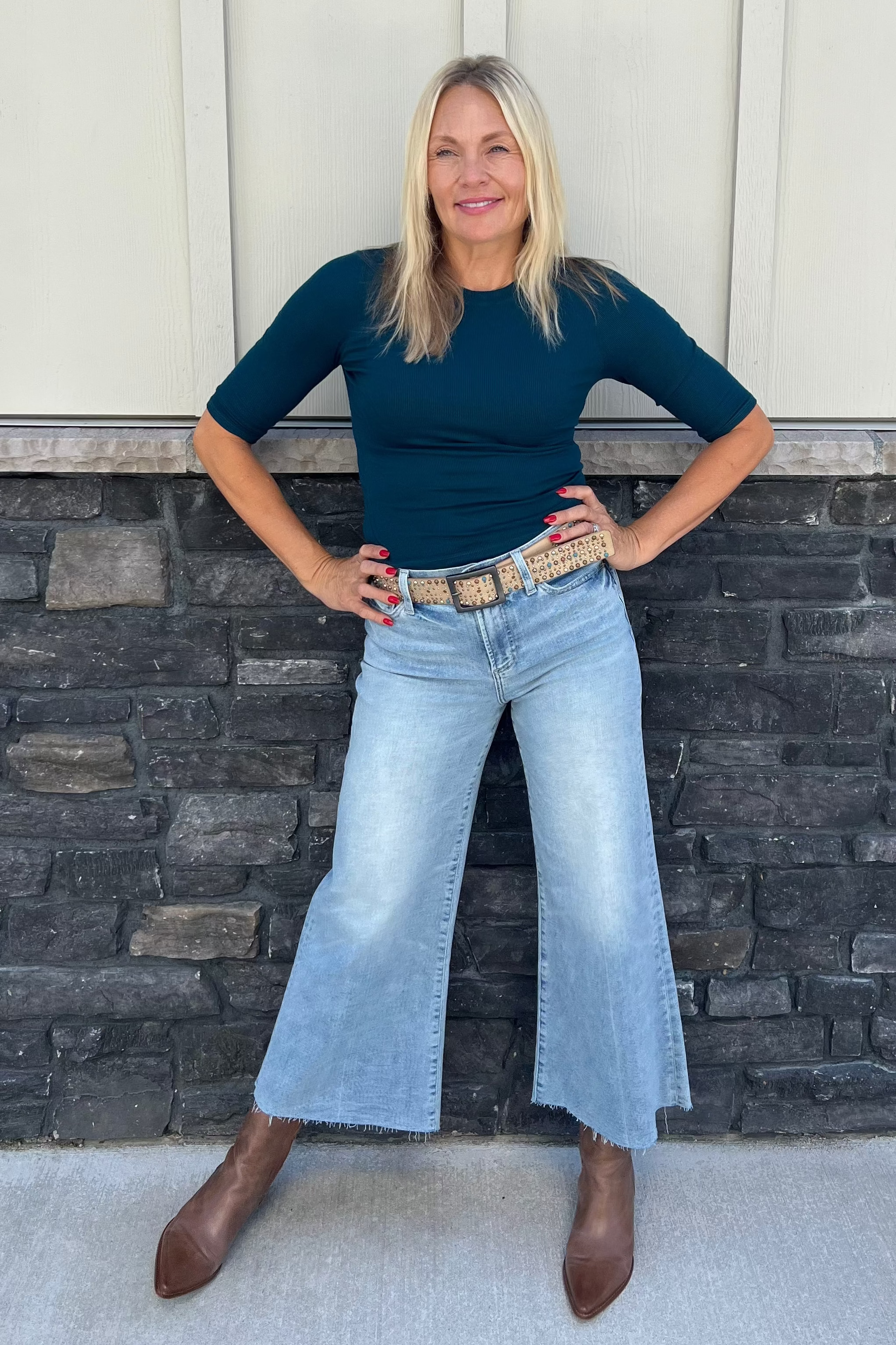 The Maeve Crop Tee in white features a fitted silhouette with elbow-length sleeves, crafted from sustainable eco 2x1 rib fabric made of 97% Ecovera Viscose. This breathable, machine-washable top offers both comfort and style, making it an essential piece for your spring wardrobe.