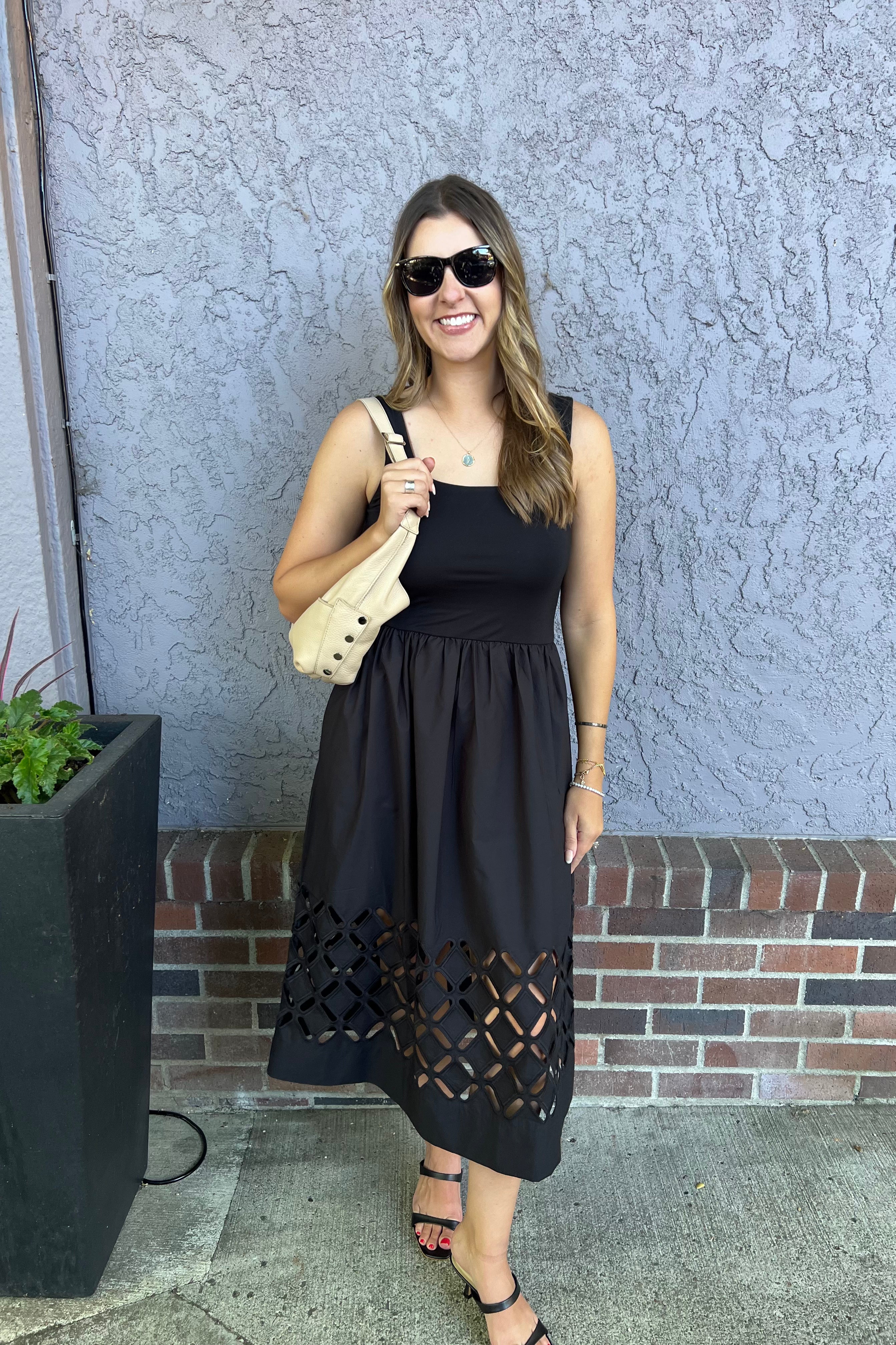 The Nadya Dress combines effortless elegance with comfort, featuring an ultra-soft scoop neck bodice. Thoughtful design details include engineered cutouts from mid-skirt to hem and discreet on-seam pockets for practicality.