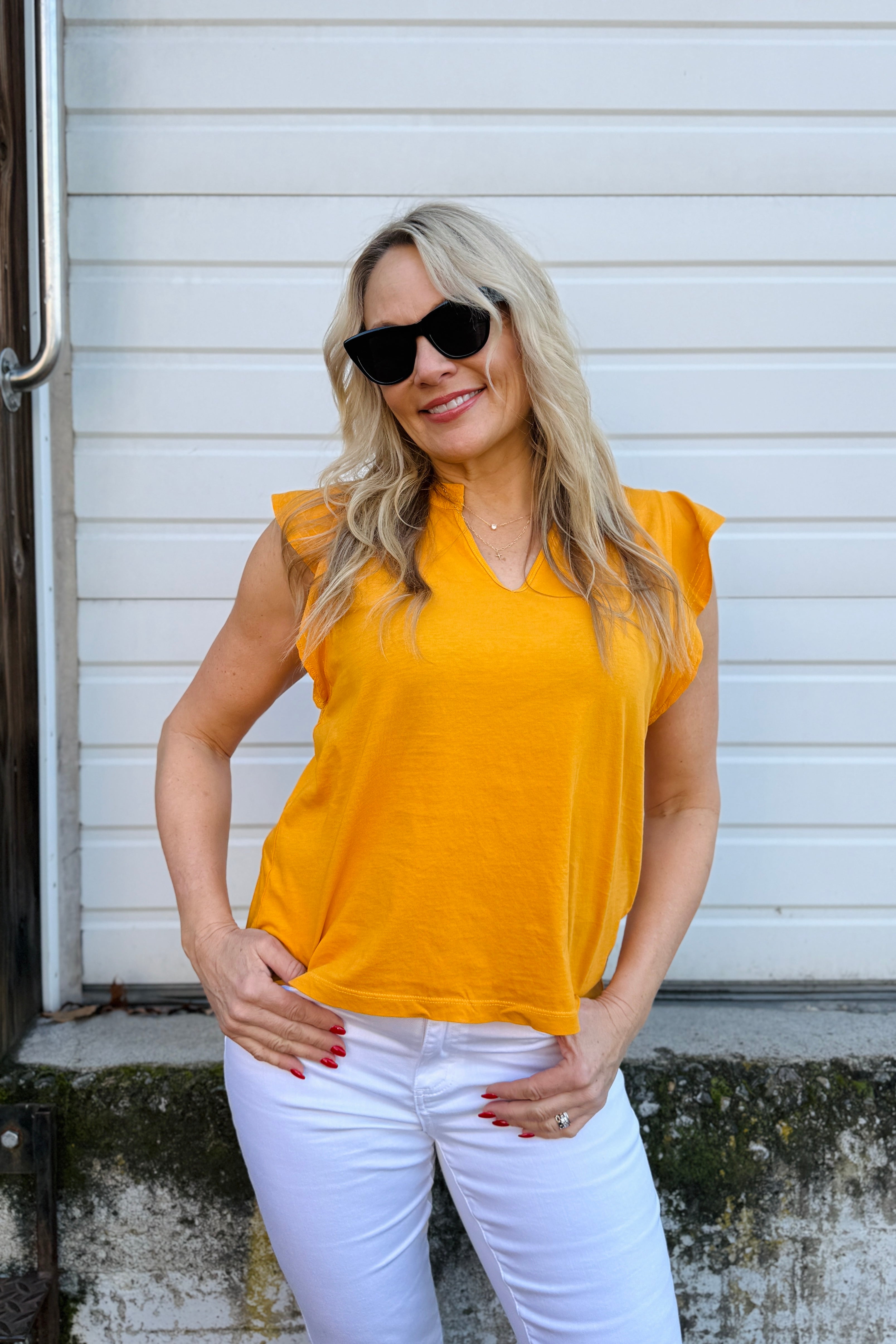 OMG this top is to die for. What a fun pop of color to add to any outfit. Us Arktana girls are obsessed with the girly details of this top.