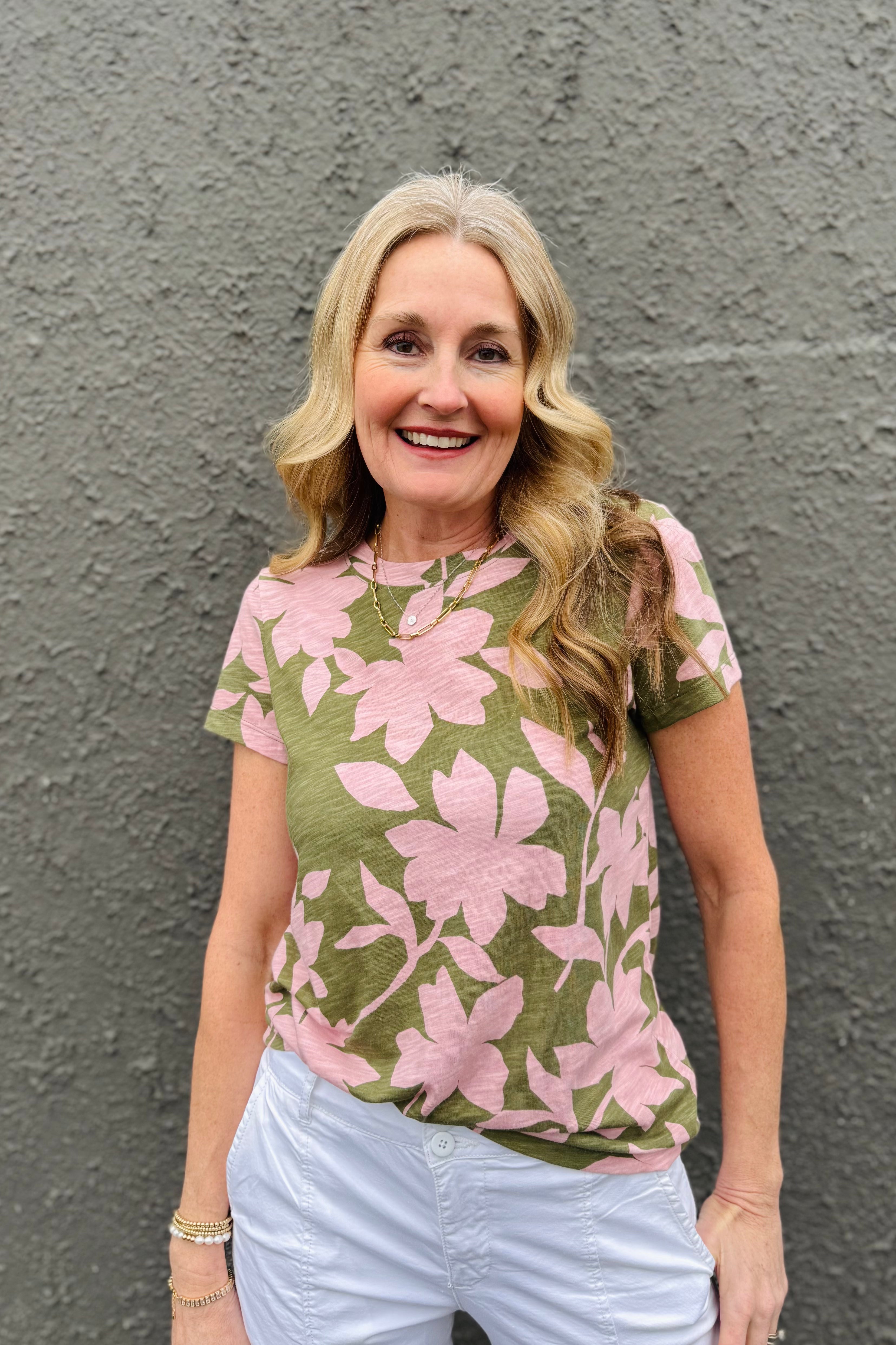 This top is great for everyday wear! Fun floral pattern with a short sleeve and crewneck. A classic top that Arktana fans love!