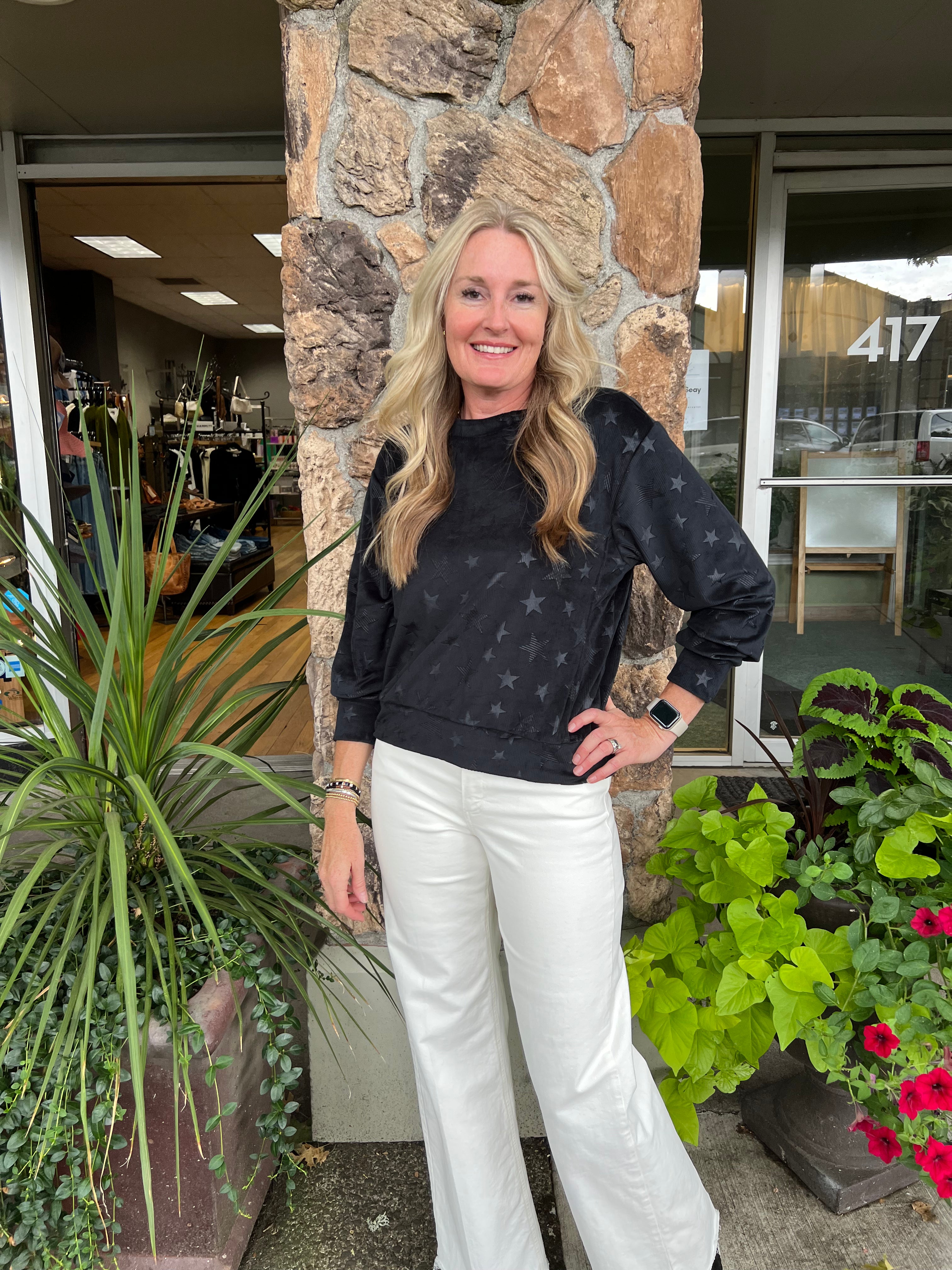 The Maeve Corduroy Star Top features a plush, velour-like texture with a soft corduroy appearance. It offers long sleeves and a classic crew neckline, combining comfort and style in a refined fabric.