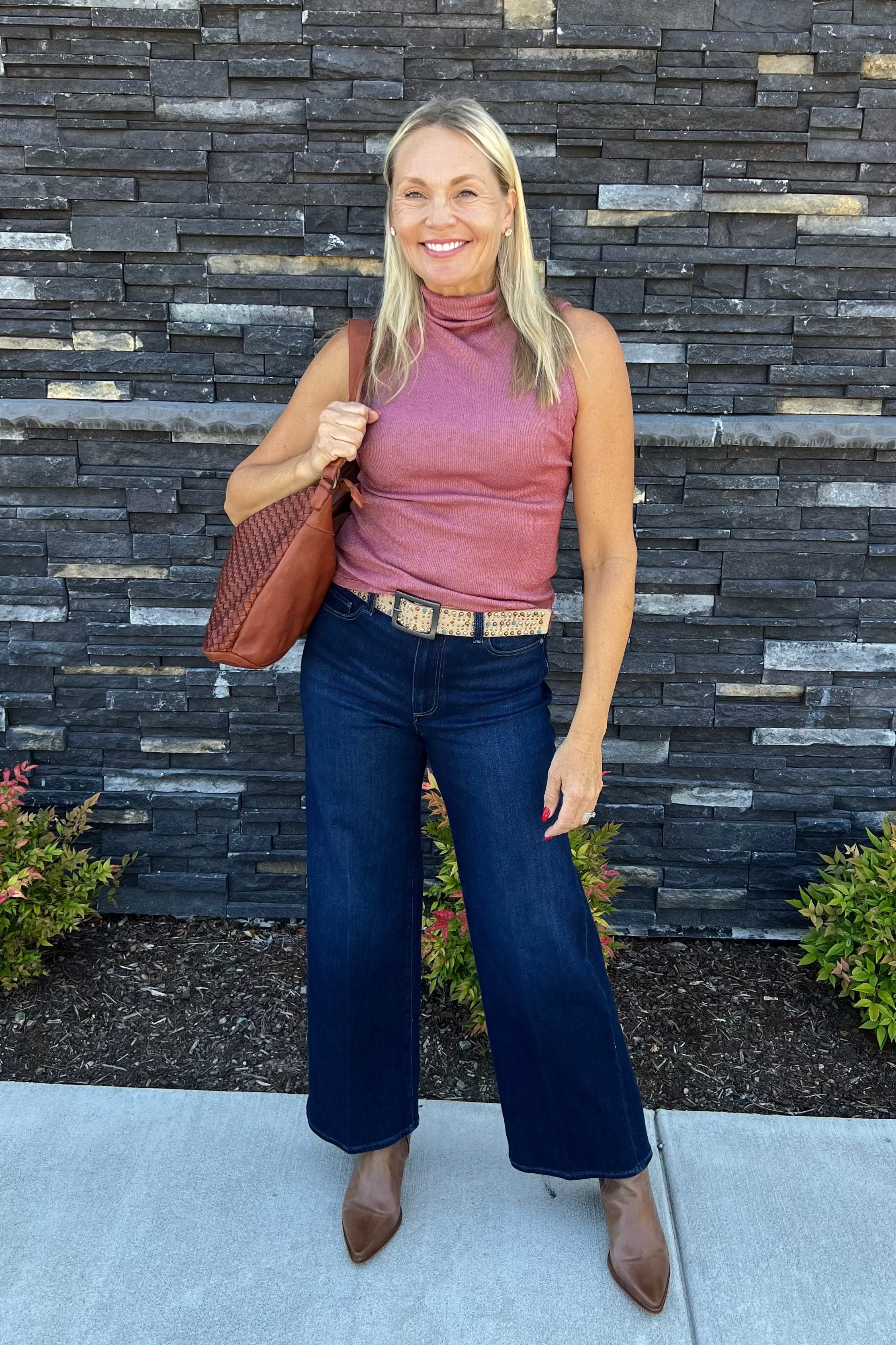 Crafted Ultra Rib fabric, the Zira Tank-Muse offers exceptional softness and stretch. Its refined mock neck with pleated detailing and subtle drape, complemented by a back seam, creates a sleek, body-hugging silhouette. Designed for a polished yet versatile look, this fitted tank pairs effortlessly with casual or tailored pieces. Easy to care for with machine wash and tumble dry, it combines comfort and style for everyday wear.