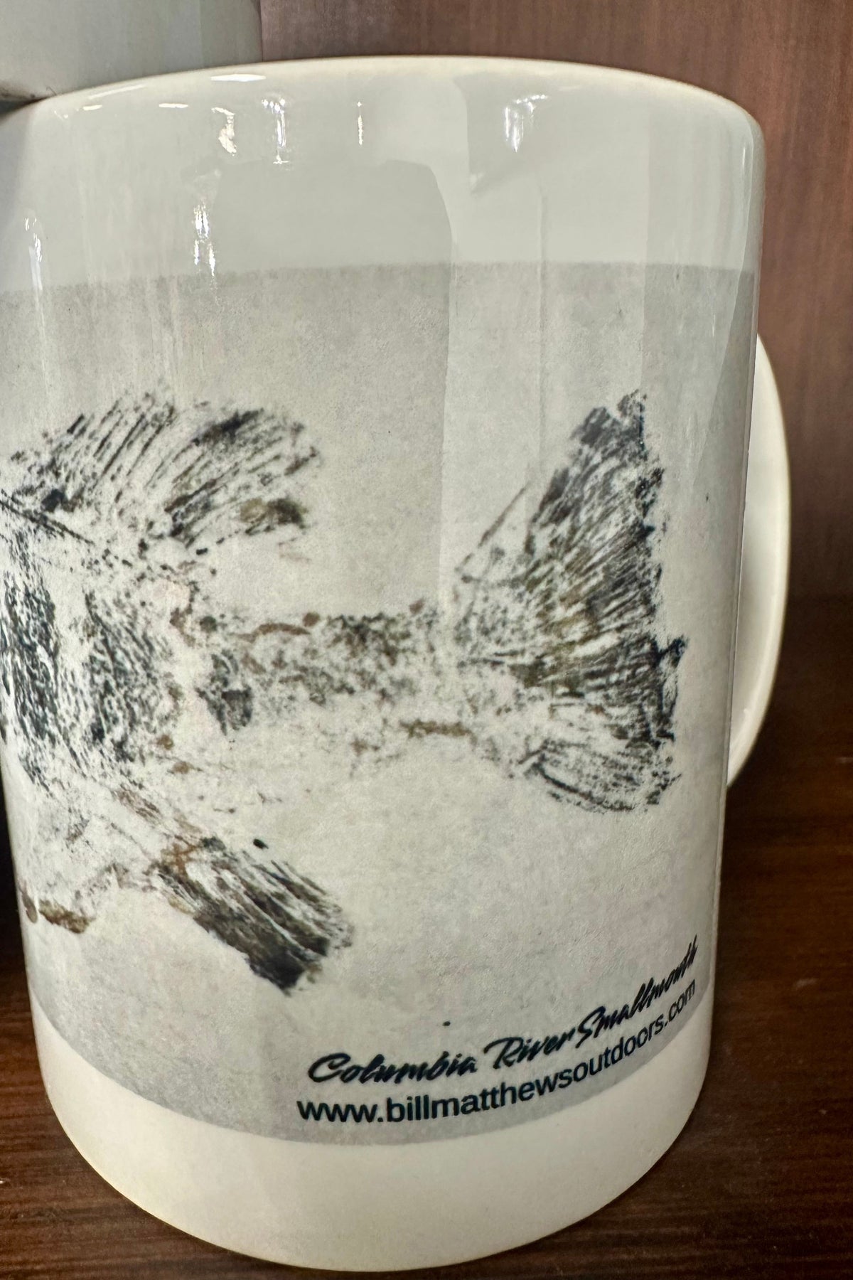 Bigfoot Mountain Outfitters Smallmouth Bass Gyotaku coffee mug with original BMO fish rubbing art, a great gift for bass anglers to enjoy morning coffee at home, the office or the cabin