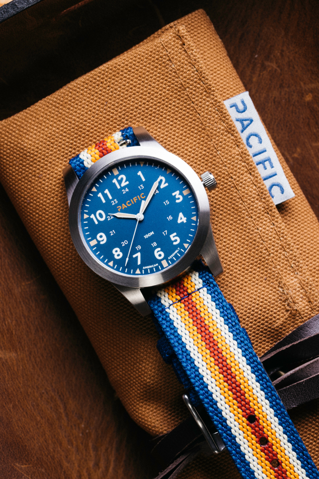 Pacific Watch Company Cascadia field watch in Slate Blue with PWC Stripe strap, a rugged USA-assembled 316L stainless steel watch for hiking, fishing, travel and everyday wear, a great gift for him