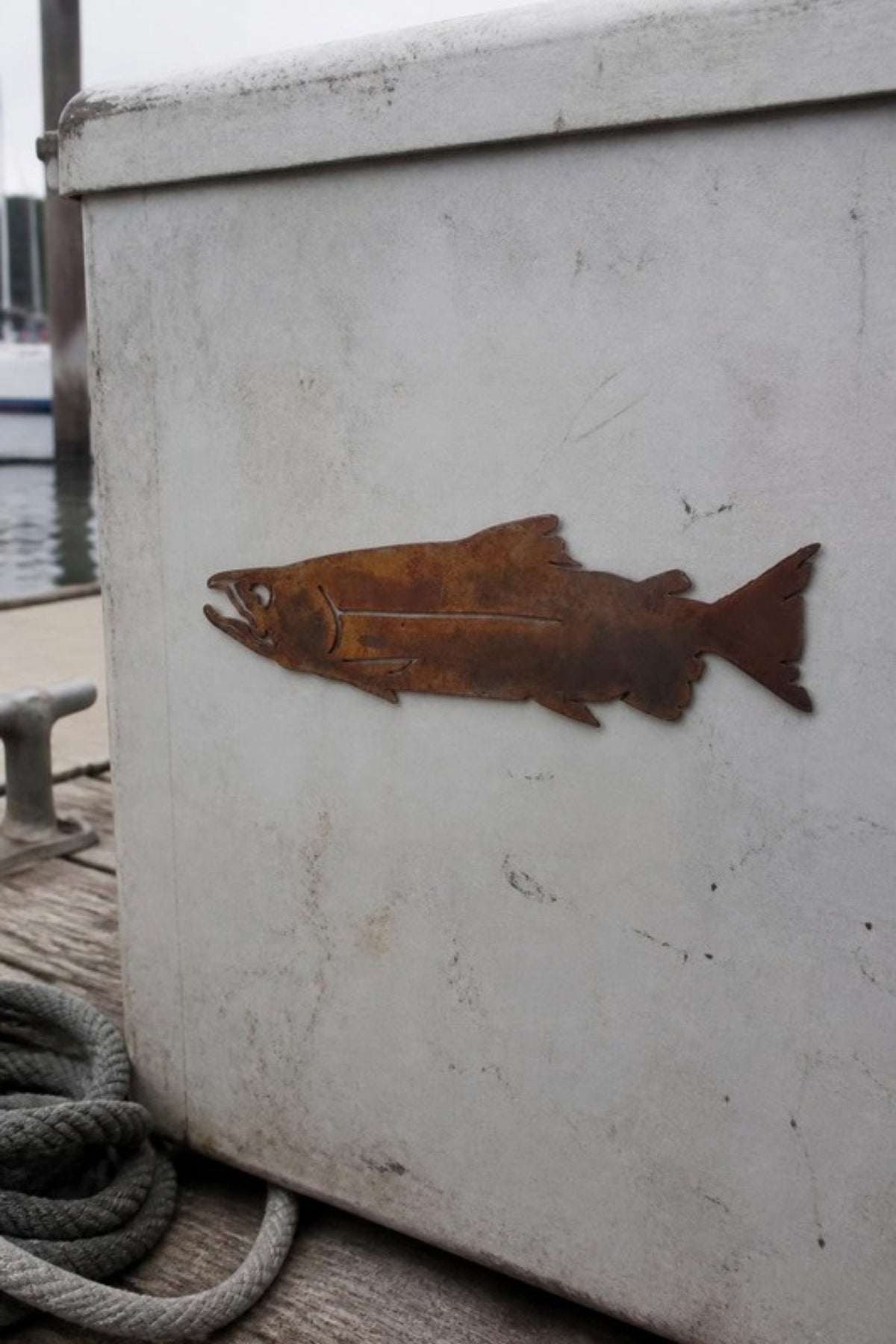 Paradise Cay Publications Chinook salmon magnet on a boat cooler at the dock, a stone-tumbled laser cut steel salmon magnet for the fridge, cooler, toolbox or boat, and a great gift for salmon anglers