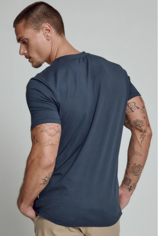 7 Diamonds Core V-neck tee in Island Blue, a soft, stretchy, sustainable everyday tee for layering under a jacket, travel days, the gym and weekends