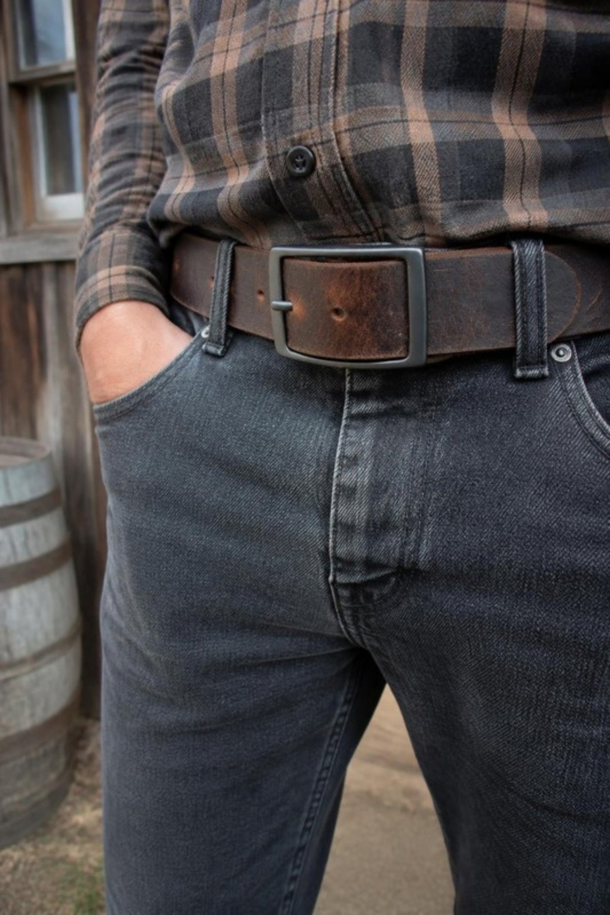 Fosterweld Crazy Horse Leather Belt in Brown worn with dark jeans and flannel, a distressed full-grain leather belt that gets better with age for work, weekends and everyday jeans