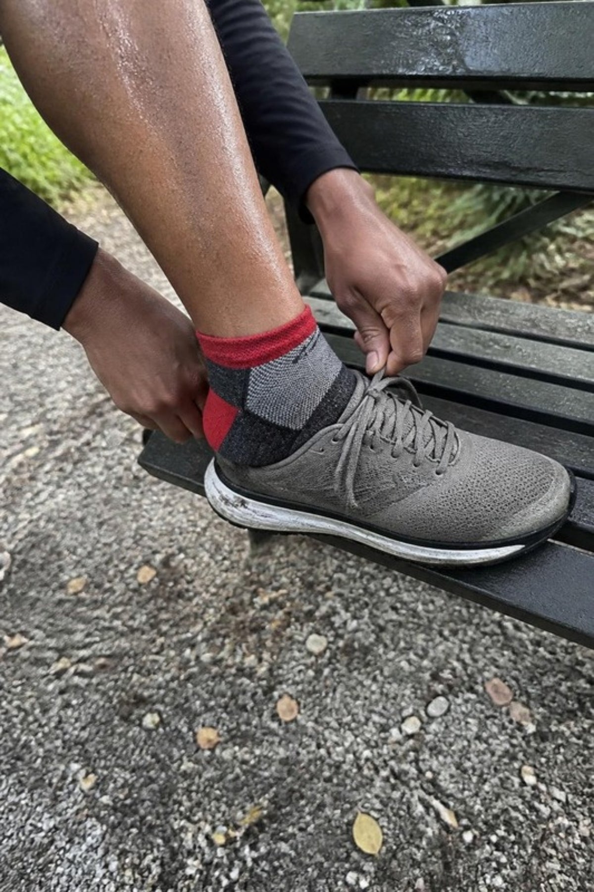 Darn Tough Men's 1437 No Show Lightweight Running Socks in Team DTV worn with running shoes, breathable merino no-show socks that stay put and keep feet blister-free on runs, gym sessions and summer sneaker days, guaranteed for life