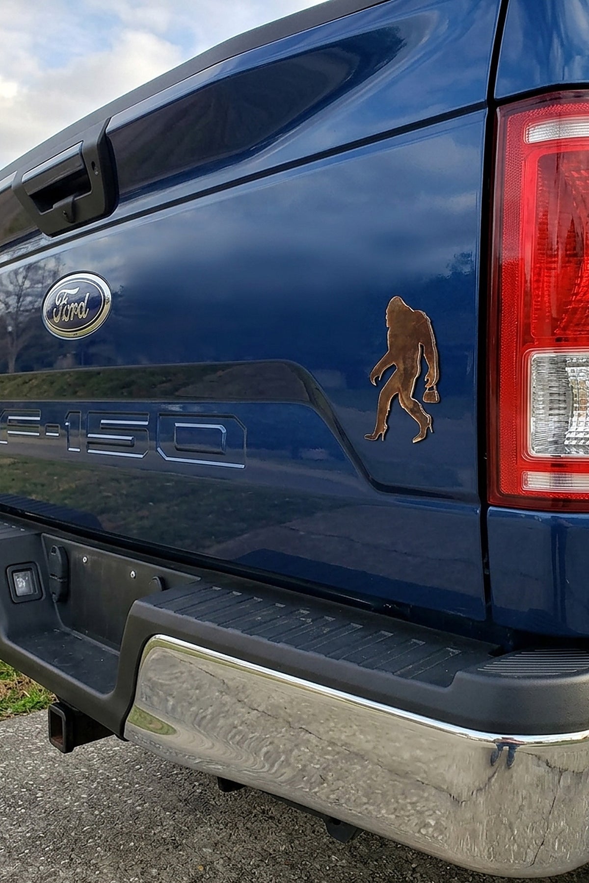 Paradise Cay Publications Sassy Squatch magnet on a truck tailgate, a fun Bigfoot-in-heels magnet that adds personality to the truck, fridge or toolbox