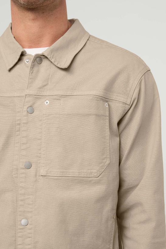 DUER Stretch Canvas Work Jacket in Garment Dye Sand, a rugged, good-looking layer for the office, outdoor adventures and chilly evenings