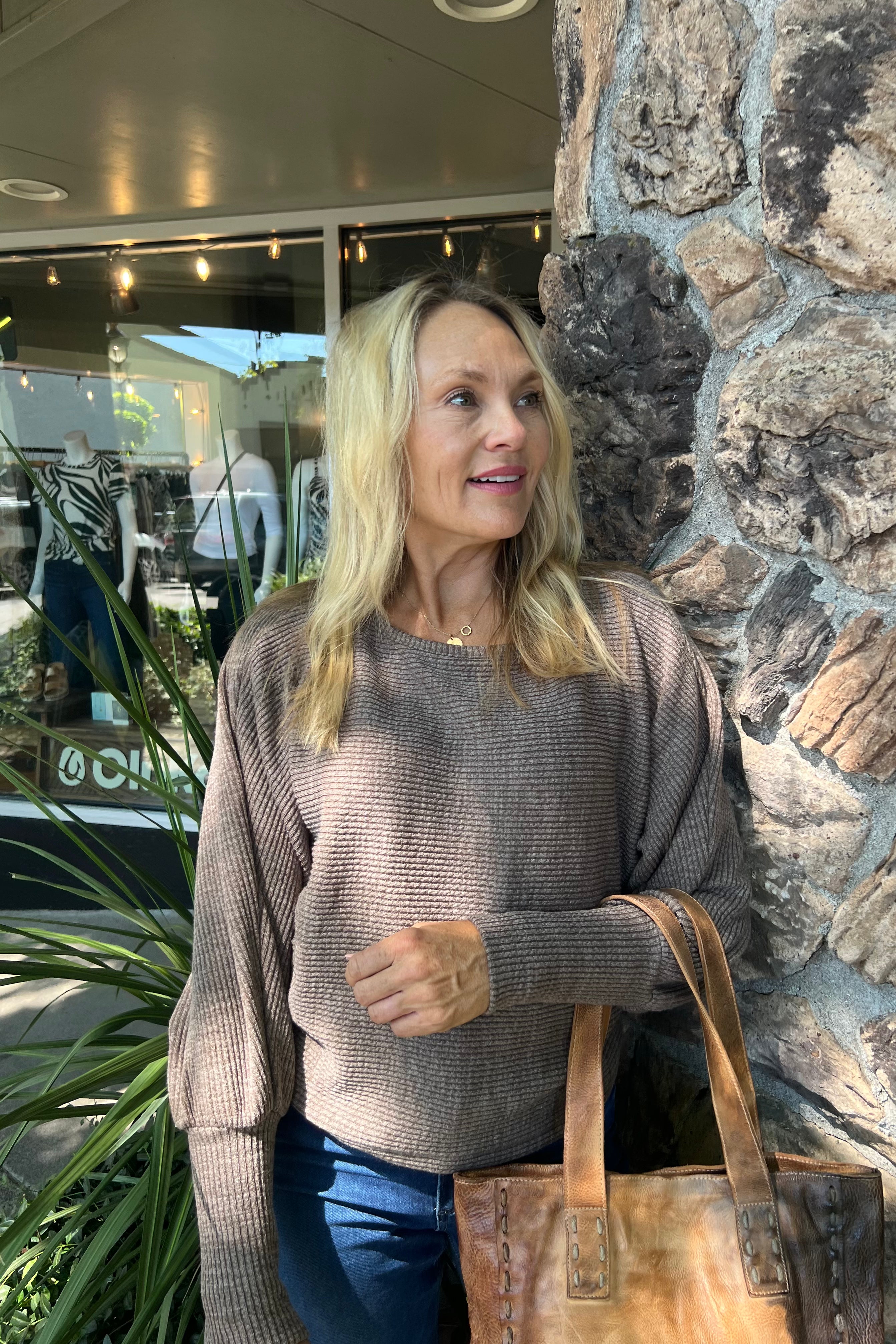 This Dylan Andie Dolman Knit Top features a soft brown shade and long sleeves with ribbed cuffs for a refined look. Crafted from a comfortable blend of 90% polyester, 8% viscose, and 2% spandex, it offers both softness and stretch for all-day wear. Long Sleeve, Ribbed Cuffs, and Knit Material
