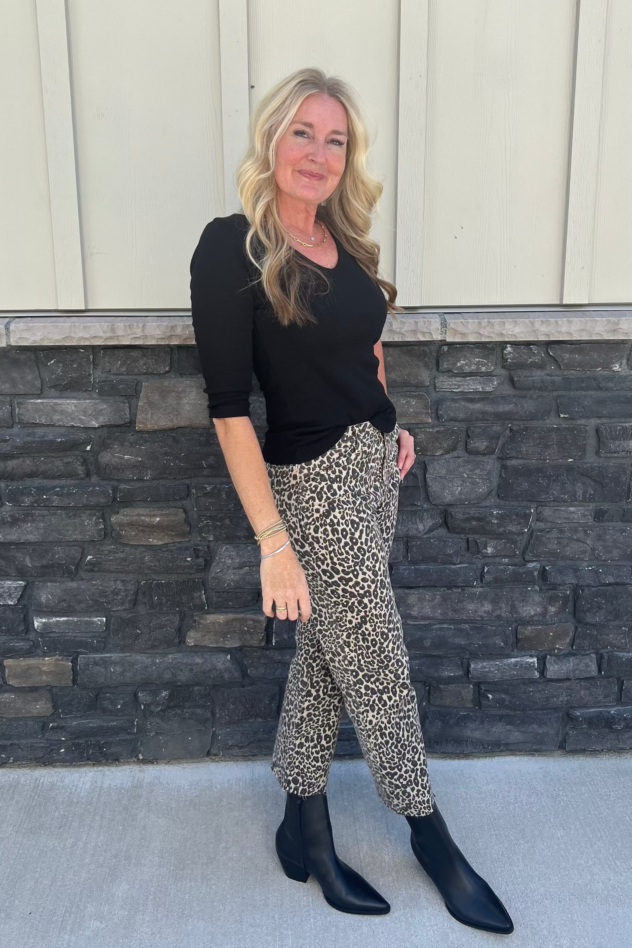 Crafted in our iconic shine fabric, the subtle sheen makes this top a chic day-to-night style. It features a delicate v-neckline and ¾ sleeves. The front is double-layered for a more weighty feel. Wear yours with a midi skirt or pants.