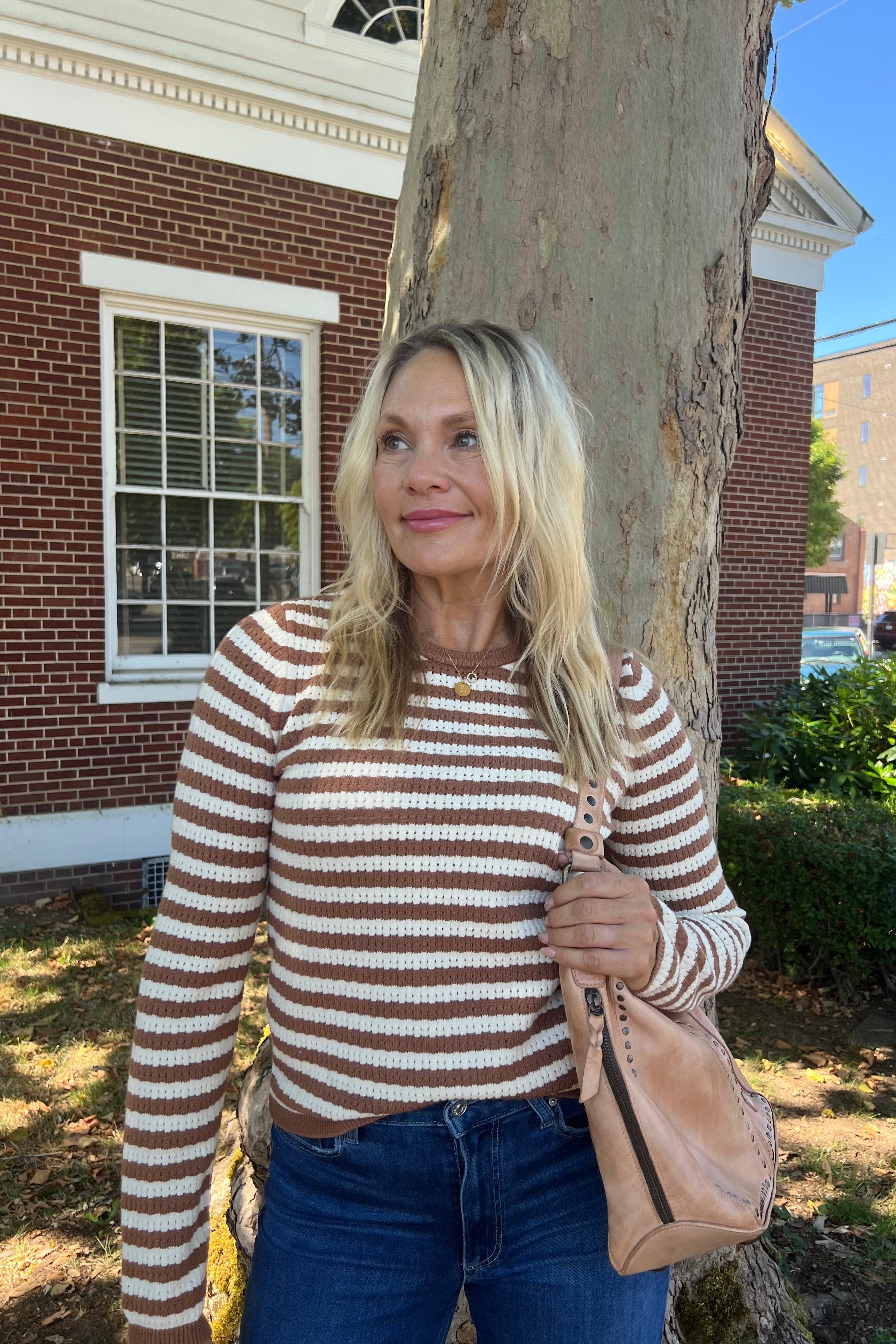 Elevate your wardrobe with the Bruna Knit Striped Sweater. Made with a stretchy, soft material, this classic and cozy sweater is a must-have for any season. With its versatile colors and irresistible comfort, you'll never want to take it off. Complete your luxury look with this exclusive piece.