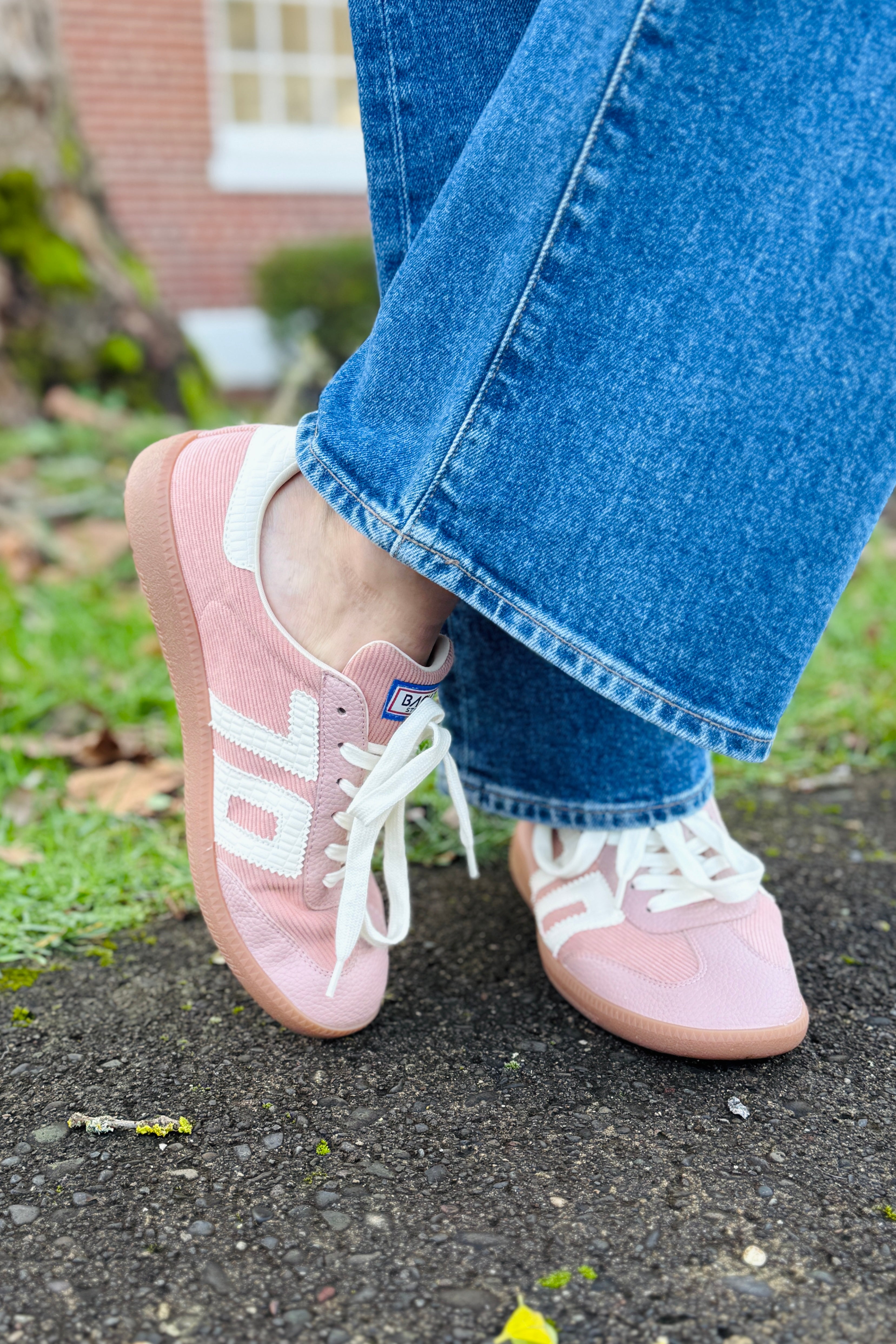 Embrace modern Italian street style with nostalgic, soccer-inspired sneakers. These statement kicks are scoring big time on the fashion scene with the perfect blend of planned and off-duty vibes. Refresh your streetwear looks with bold color block design, and a fusion of retro cool and modern edge. These muted neutral tones are your go-to palette for effortless sophistication executed in quiet luxury.