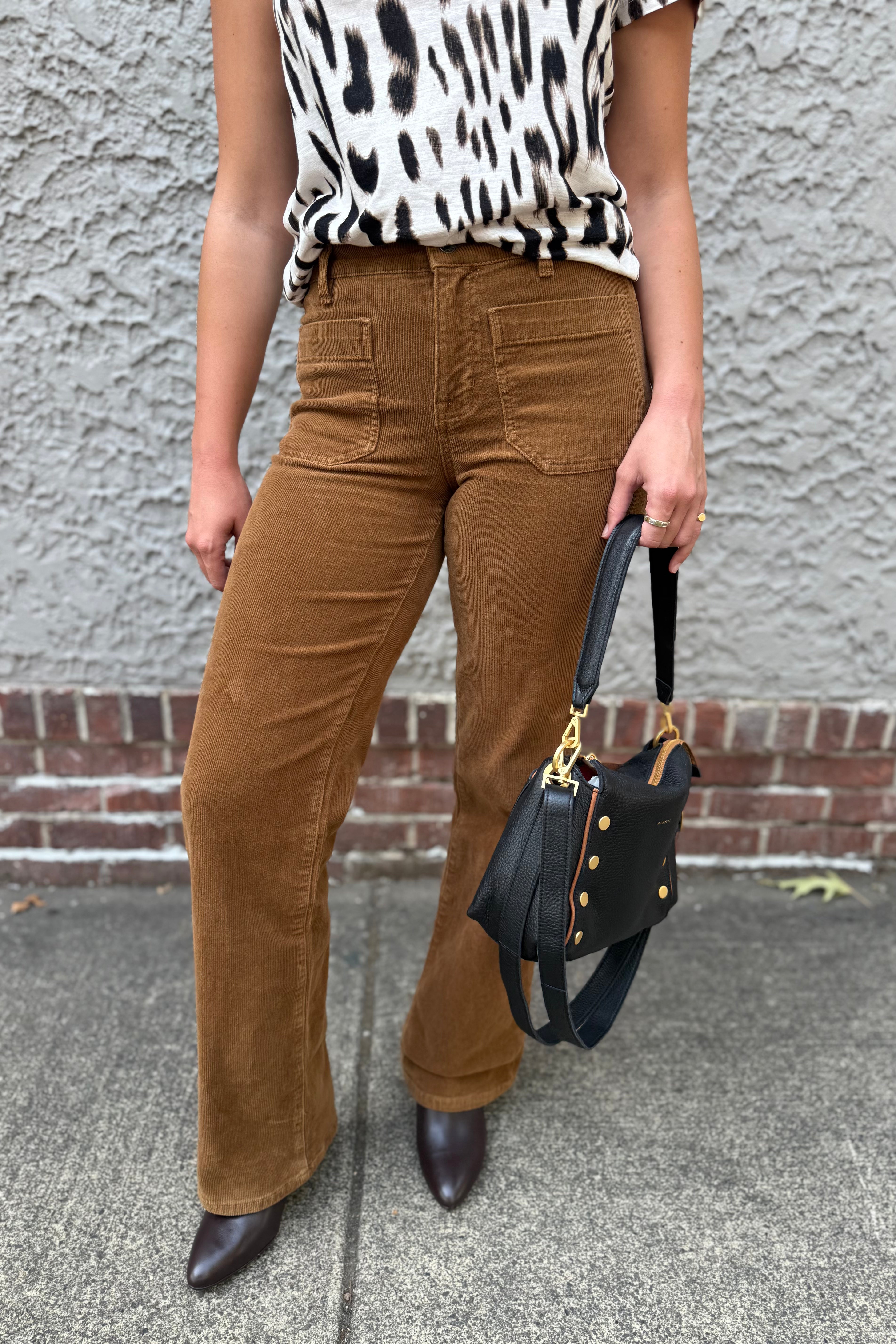 Crafted in durable corduroy, these marine-inspired trousers feature a standard rise and full-length straight leg for a classic, versatile silhouette. Designed with a relaxed fit, they combine comfort with structure, enhanced by two front patch pockets and two back pockets for practical storage.&nbsp;