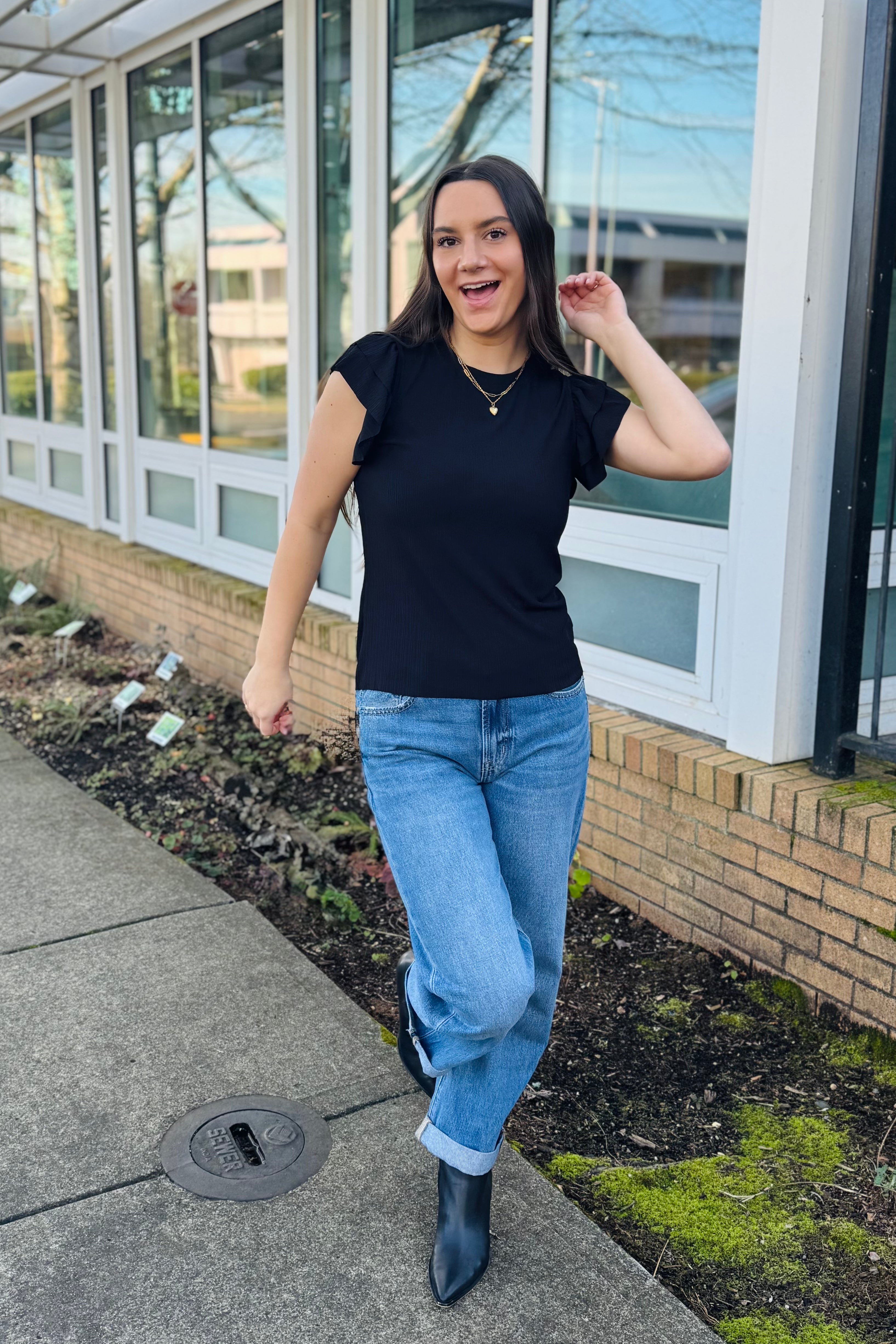 This top is the perfect mix of classic and a little flirty. The texture gives it dimension so it’s not just “another black top, and the ruffle sleeves add that soft, feminine touch without being over the top.Dress it up with trousers and heels, or keep it easy with denim and sandals. Work, date night, girls’ dinner in both location Camas, WA & Ridgefield, Wa