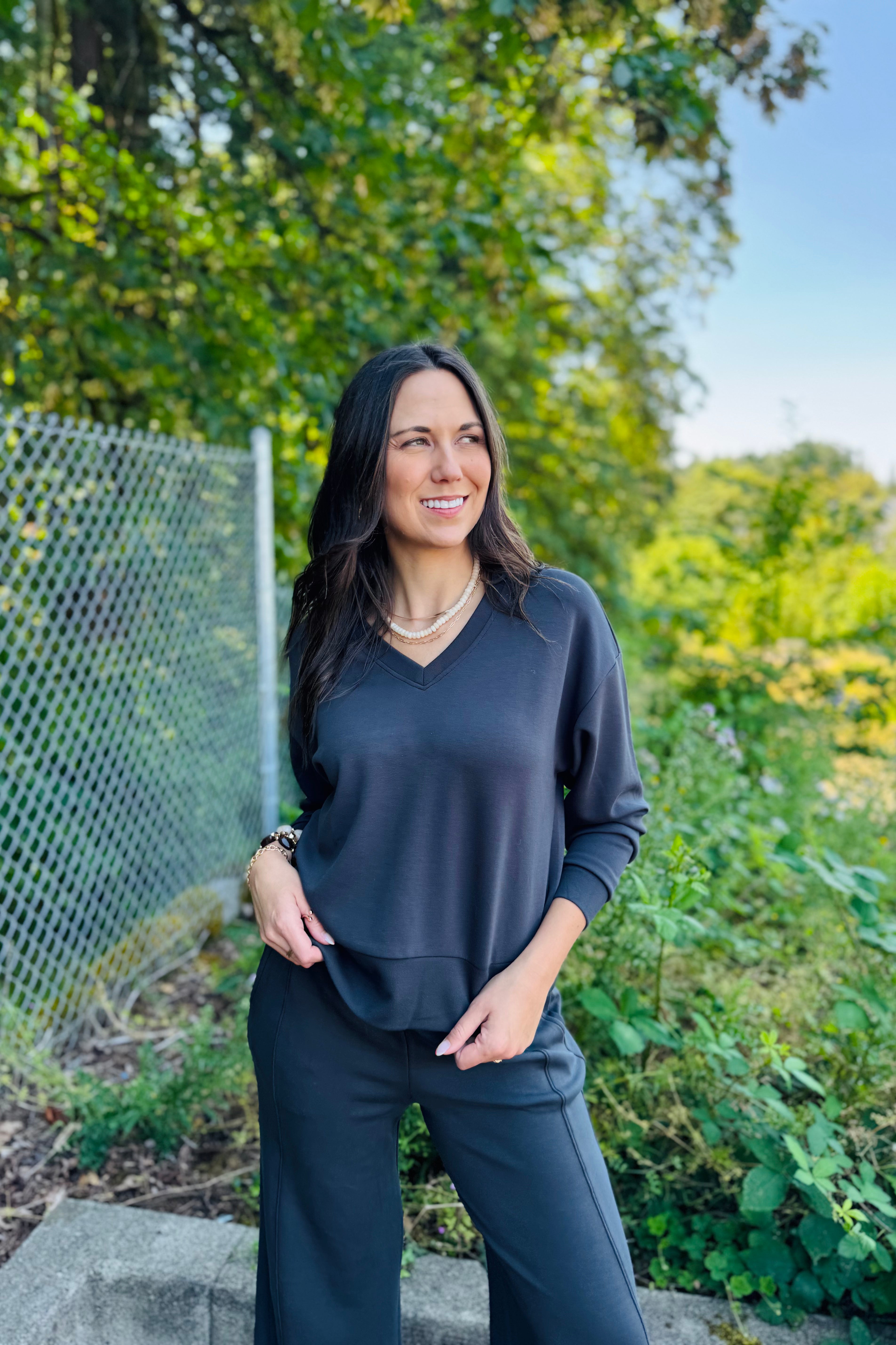 This easy-to-wear top is one you'll reach for again and again. The relaxed fit, flattering V-neck, and buttery-soft fabric make it perfect for everyday wear. Pair it with your favorite jeans, leggings, or trousers for an effortlessly put-together look that's as comfortable as it is stylish.