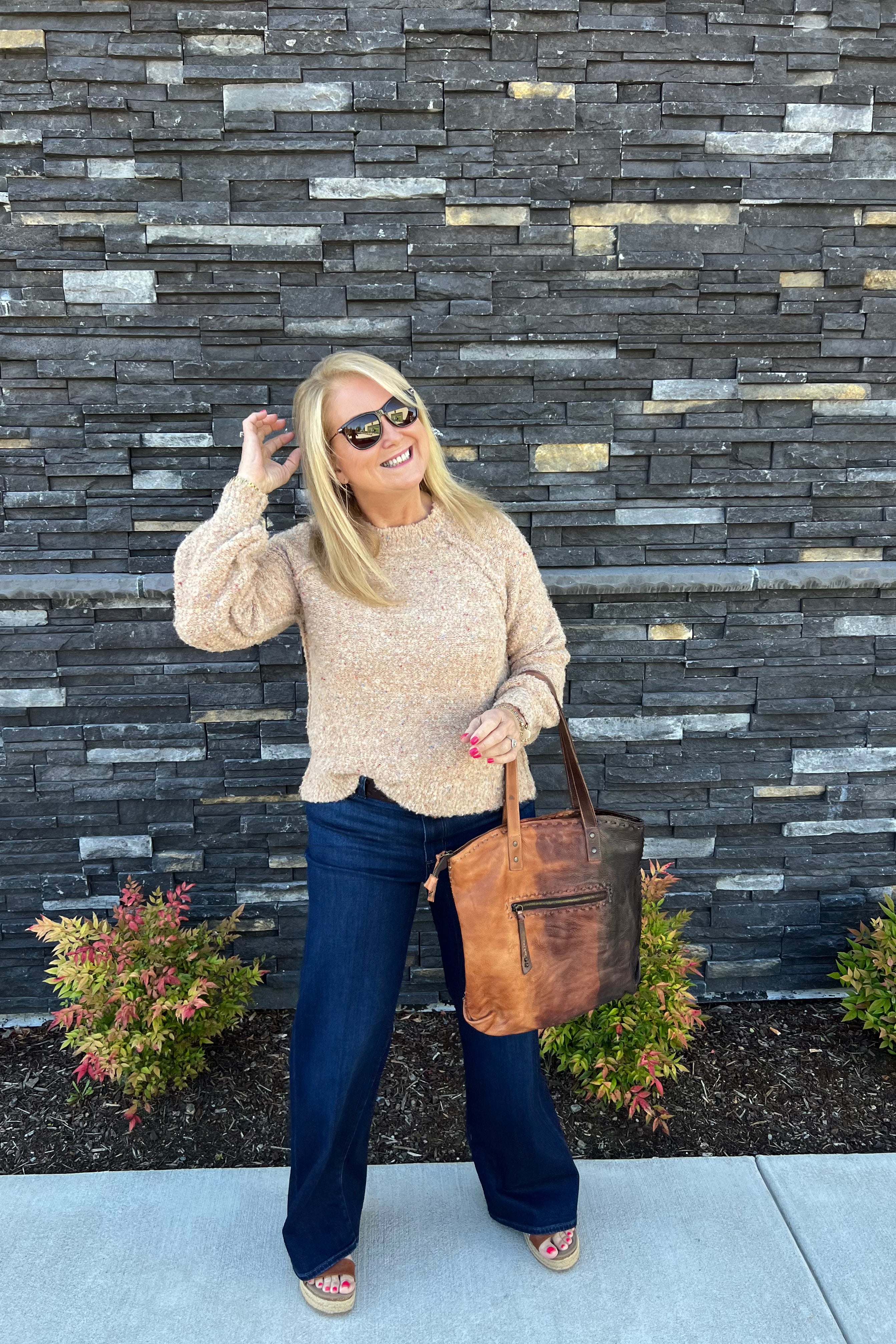 The Crew Neck Sweater&nbsp; combines contemporary design with practical comfort. Its fun texture with small pops of color enhance visual appeal. This versatile sweater is an essential addition to a refined wardrobe, suitable for both casual and polished looks.