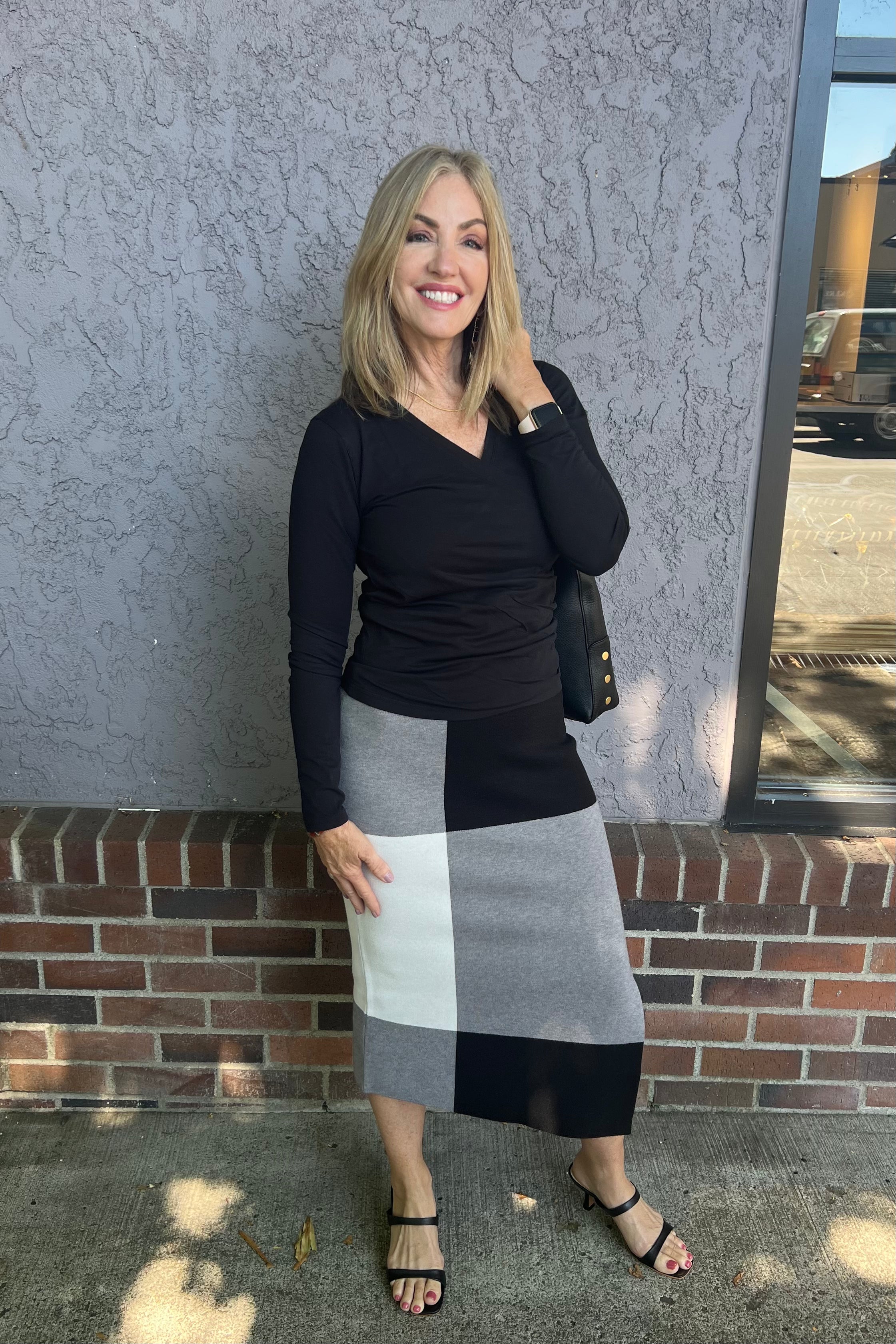 This long sleeve surplice top by Pure Amici serves as an essential wardrobe staple with a stylish twist. Versatile enough to complement both denim and tailored trousers, it effortlessly elevates your everyday look.