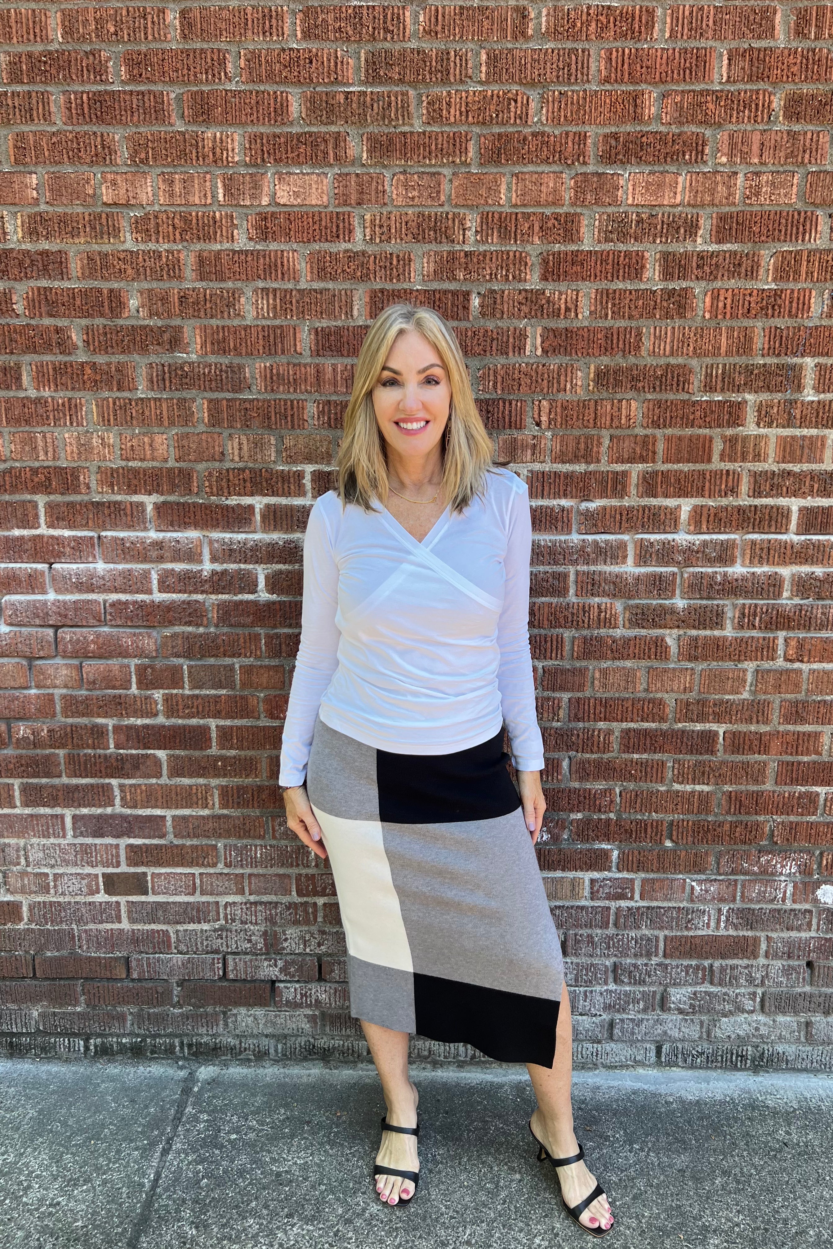 This long sleeve surplice top by Pure Amici serves as an essential wardrobe staple with a stylish twist. Versatile enough to complement both denim and tailored trousers, it effortlessly elevates your everyday look.

Wrap top
Long sleeve
Ruched sides