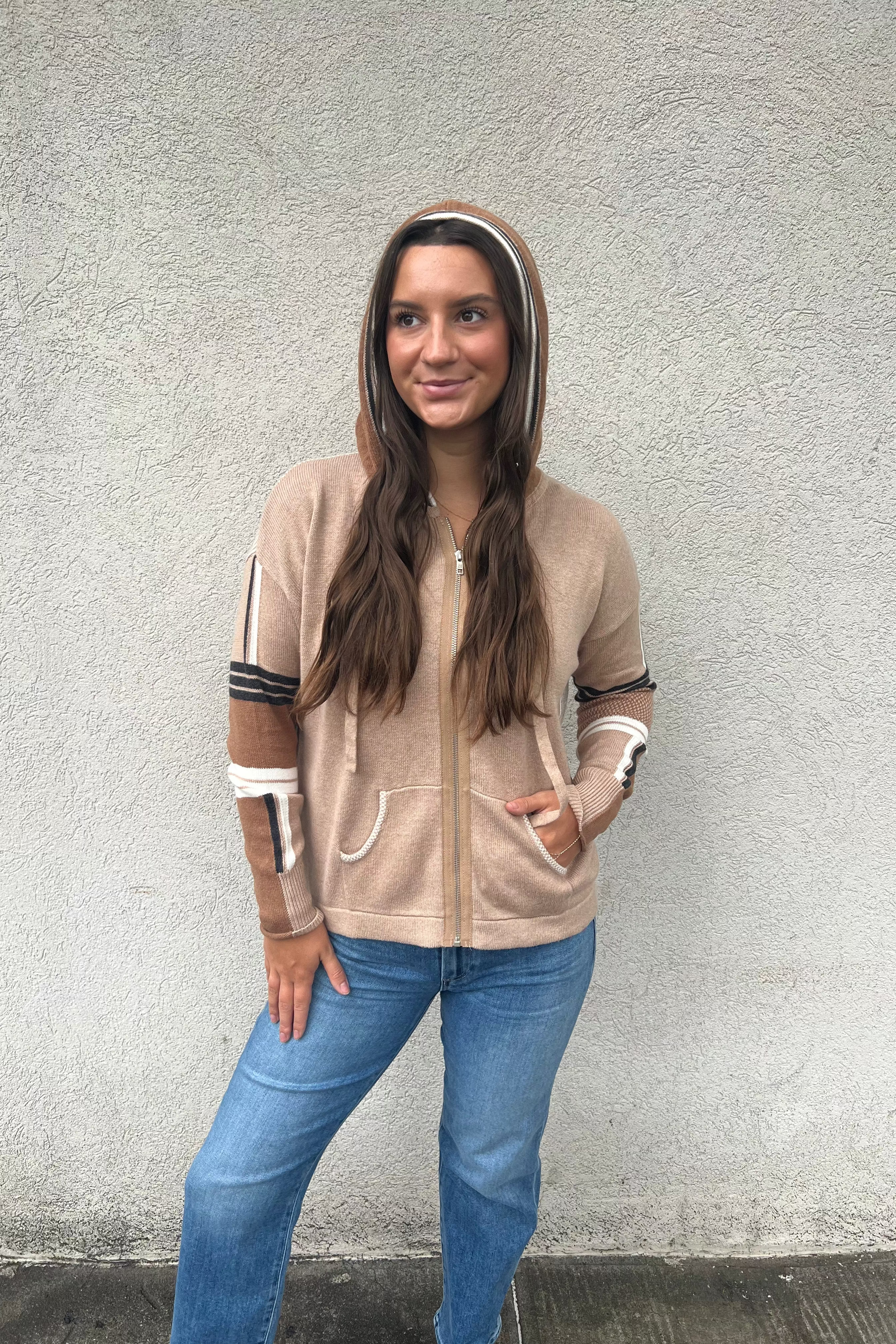 The Multi Media Hoodie by Zaket and Plover showcases expert craftsmanship through its blend of knitting techniques, creating a distinctive textured design across varied blocks. This hoodie’s sporty, retro-inspired style pairs with a super relaxed, classic fit, ideal for comfortable, casual wear.