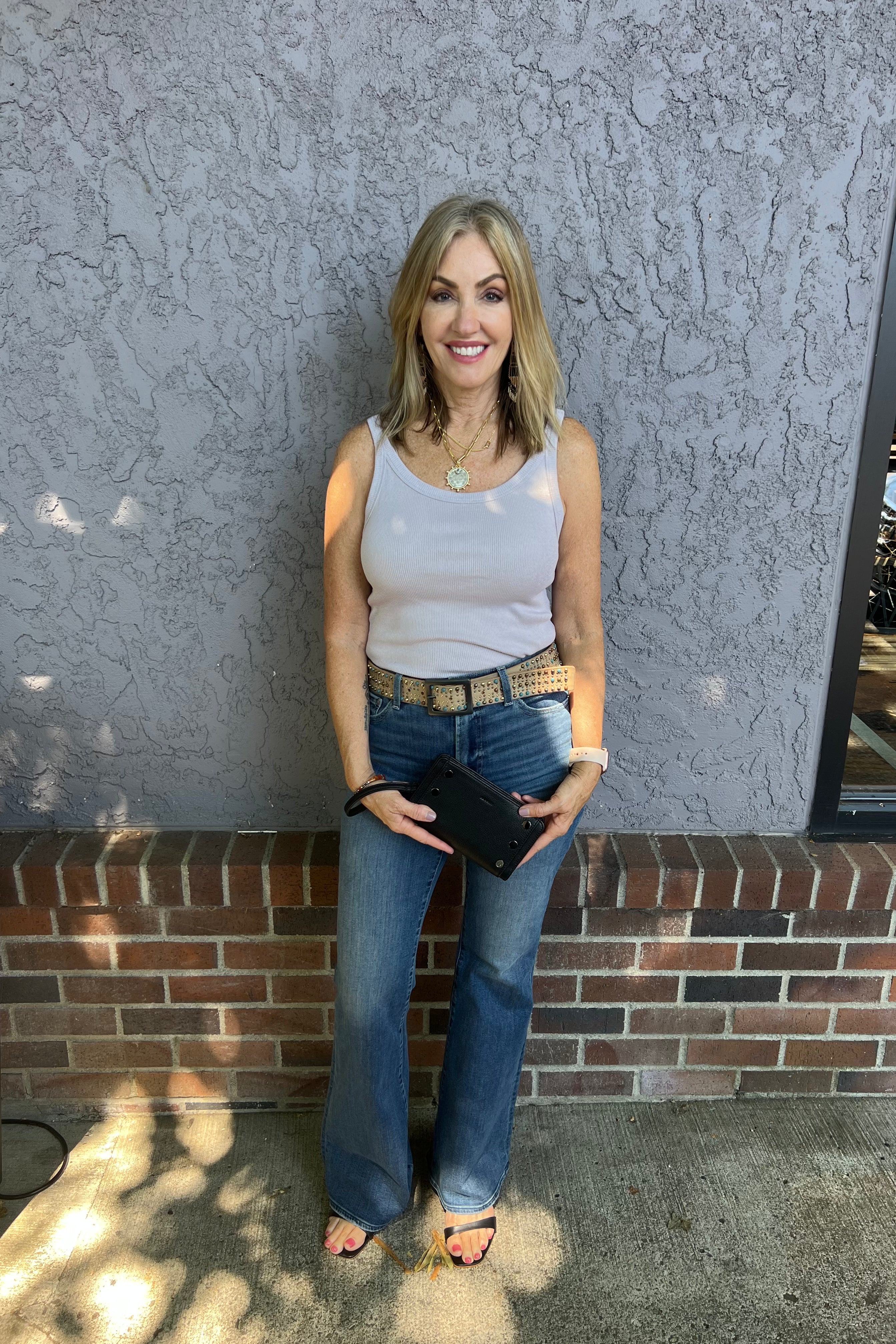 Bringing something special to your everyday tank. Crafted in our timeless, signature Shine fabric, this tank features a body sculpting fit with a scoop neckline. Dress this favorite up or down with denim, a satin skirt or your favorite lounge pants.