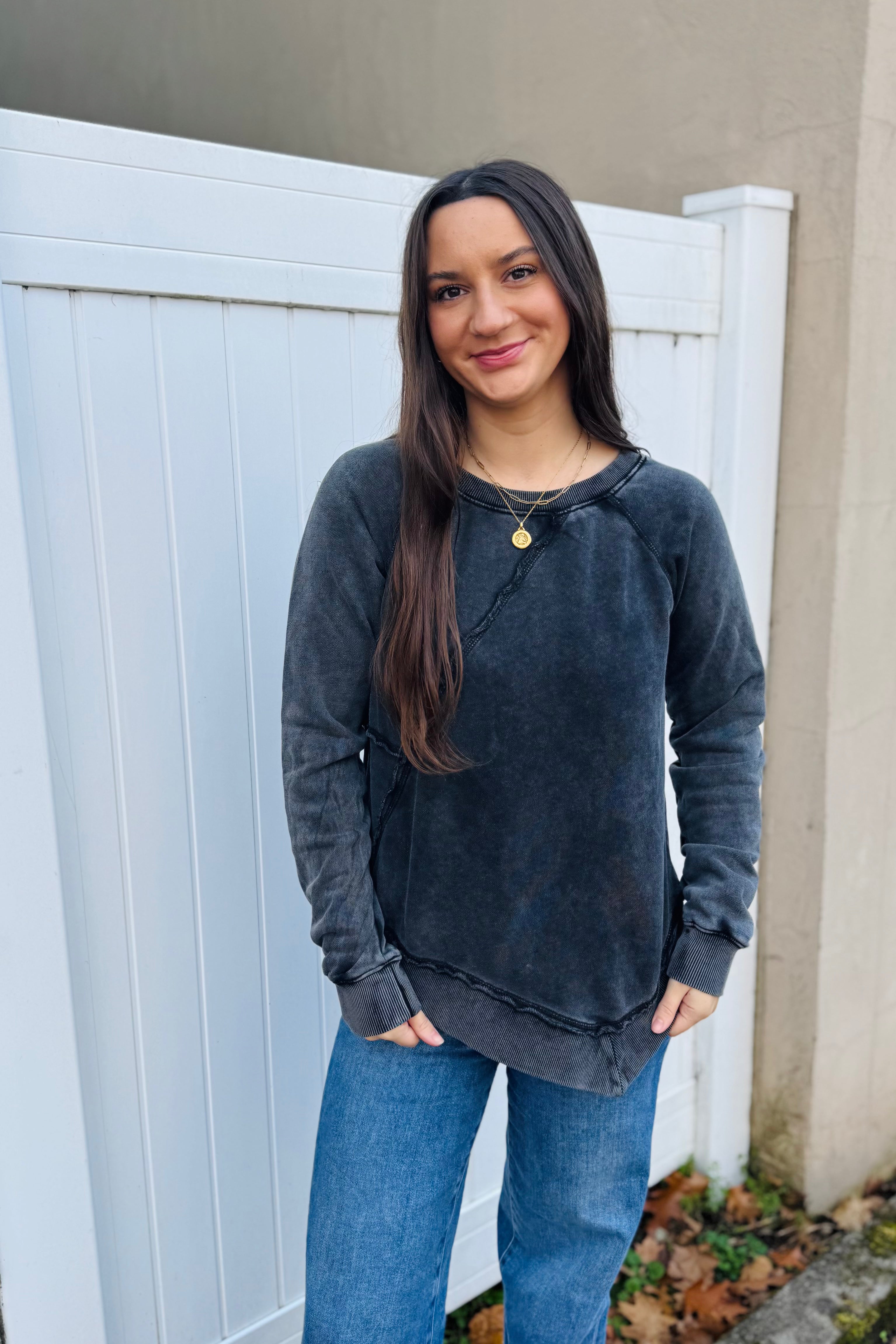 The Ryssa Asymmetrical Sweatshirt combines eco-conscious construction with contemporary design. Its mineral-washed surface creates distinctive visual interest, while the generous, unstructured fit allows complete freedom of movement. Engineered for tactile softness, this piece transitions effortlessly between casual and refined styling—pair it with classic denim or coordinate with the matching wide-leg trousers for a cohesive look.