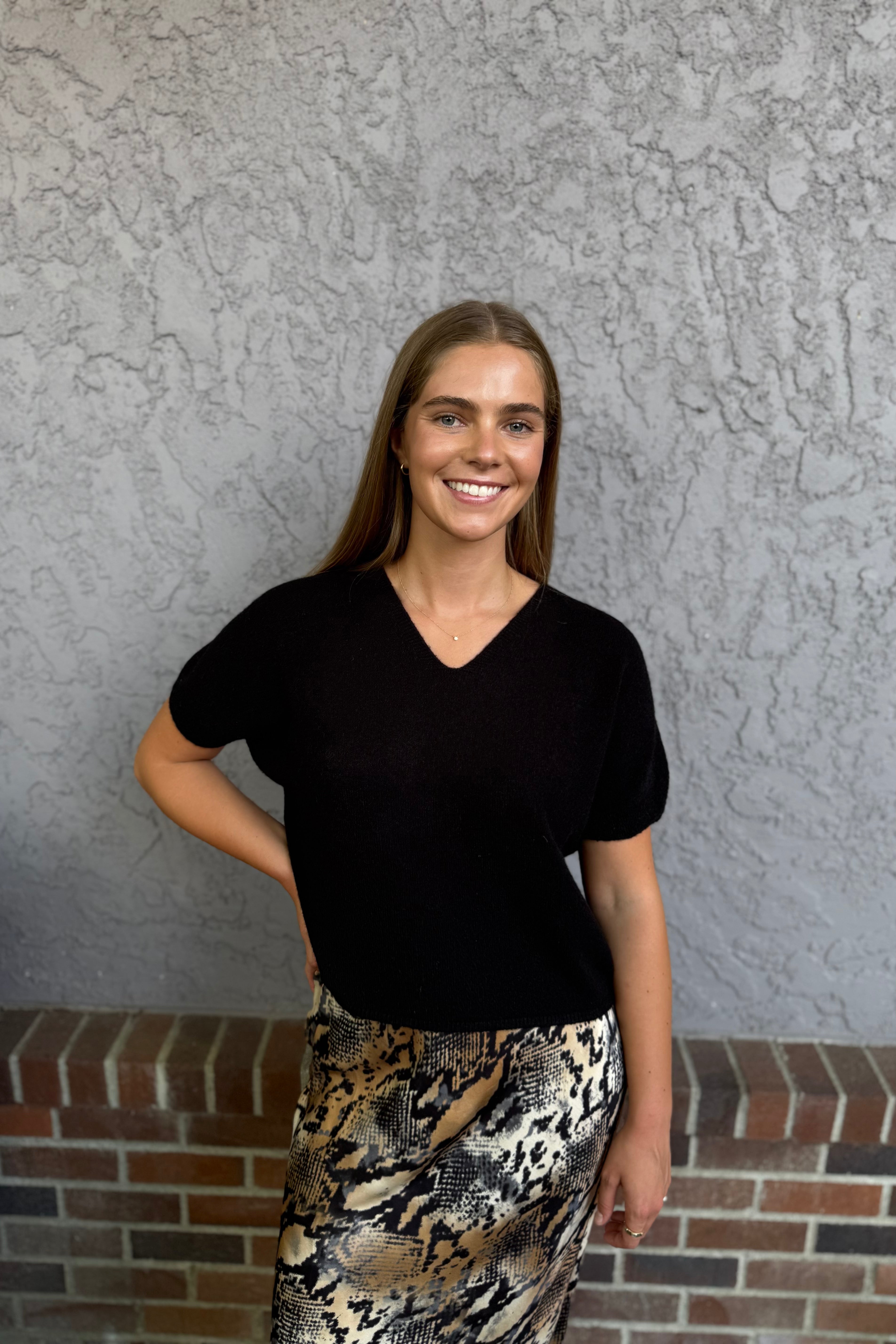 This playful knit top brings casual-chic vibes with its easygoing silhouette. Wrapped in a deliciously soft, lightweight fabric that feels like a gentle hug, it's the perfect blend of snuggly texture and fashion-forward design. Who says you can't be comfy and stylish at the same time?