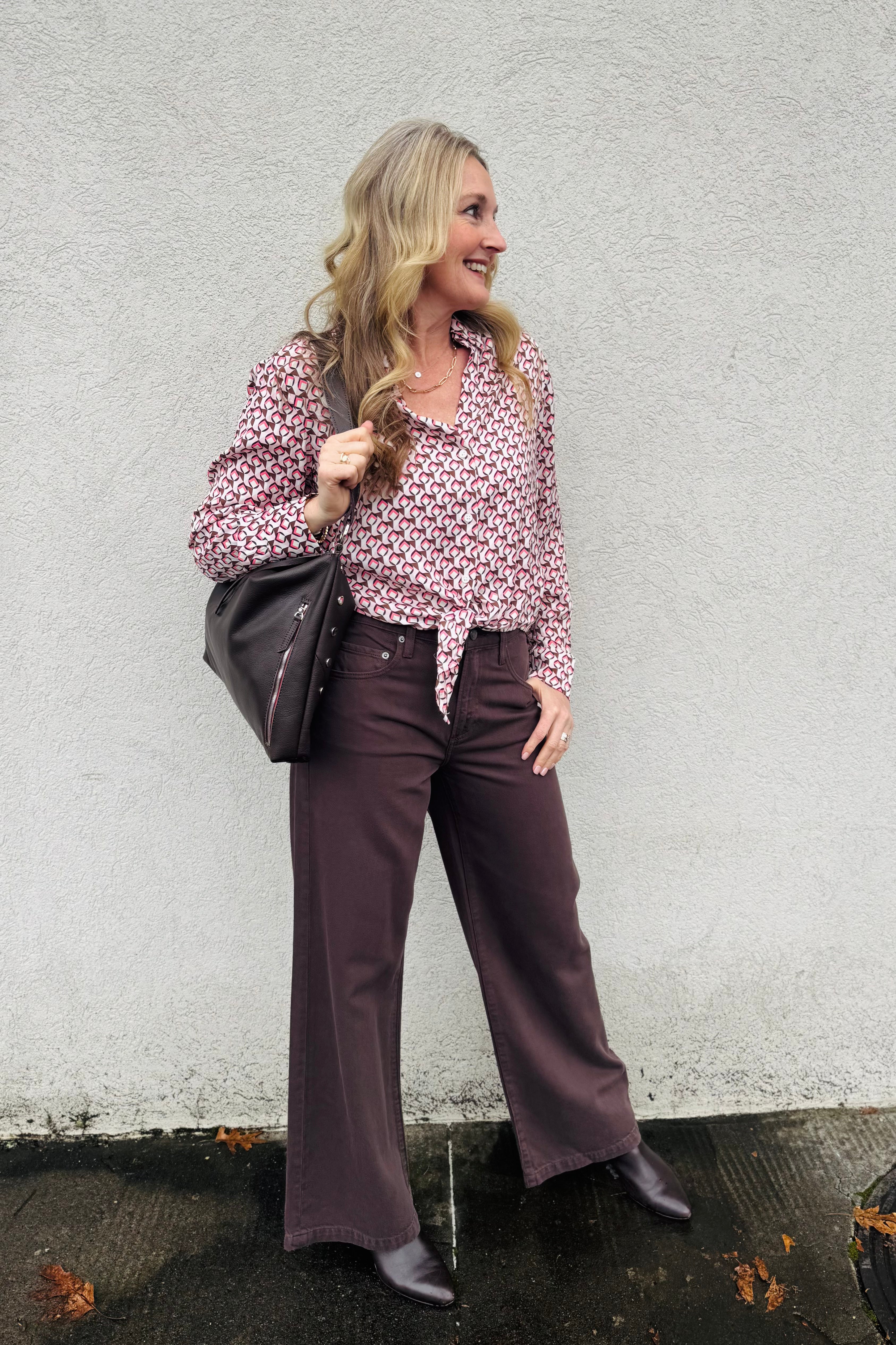 This Blouse is one of a kind!! So fun to style so many different ways!! Love the pink and brown combo with buttons down the front and a cute tie detail