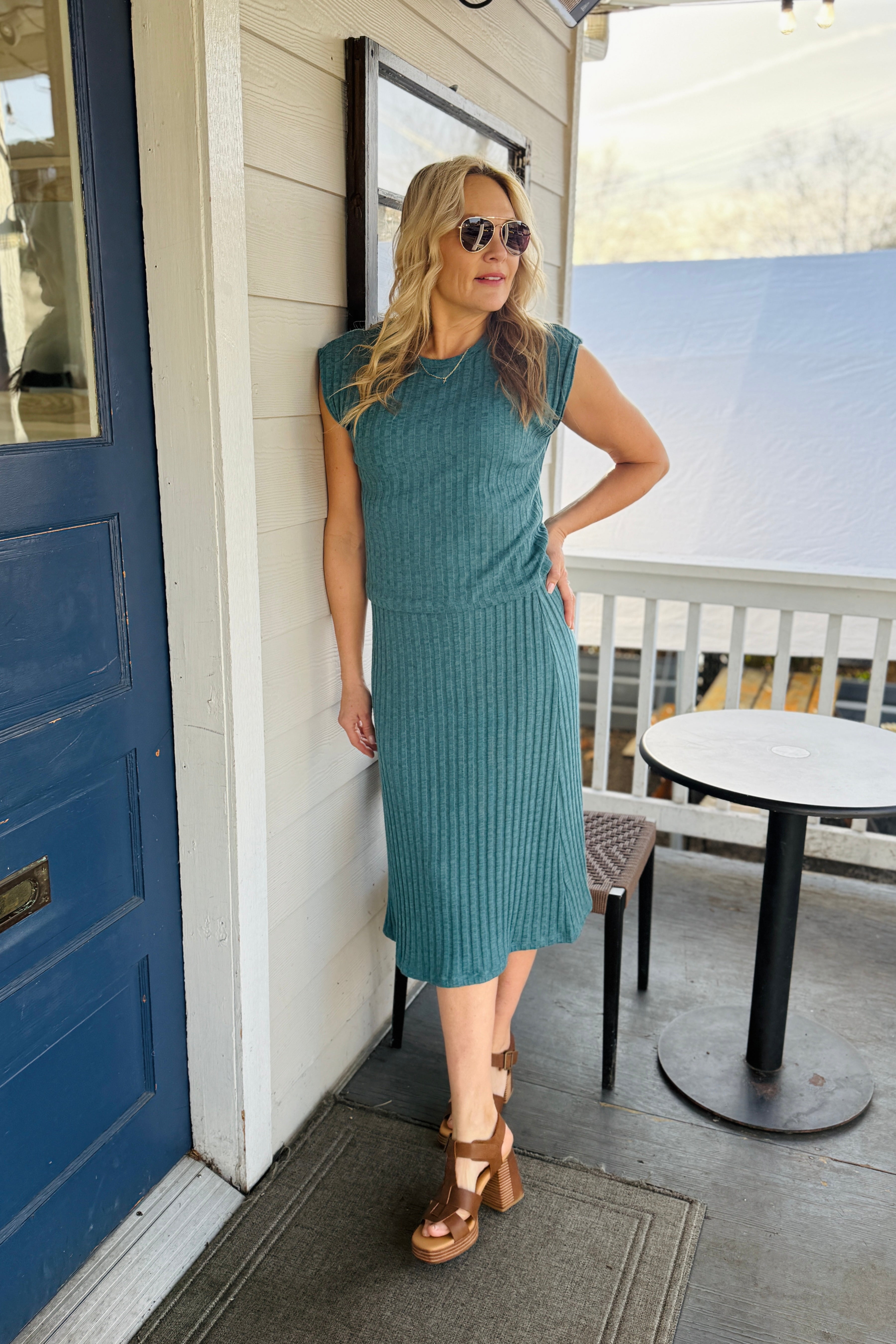 Shania Midi Skirt Crafted from premium ribbed fabric, this midi skirt delivers refined elegance with understated sophistication. The vertical ribbing creates subtle texture and visual interest while maintaining a streamlined silhouette that flatters across body types. A versatile wardrobe essential, it pairs effortlessly with fitted tops, oversized sweaters, or structured blazers for polished everyday wear or elevated occasions. The midi length offers modern coverage with timeless appeal.