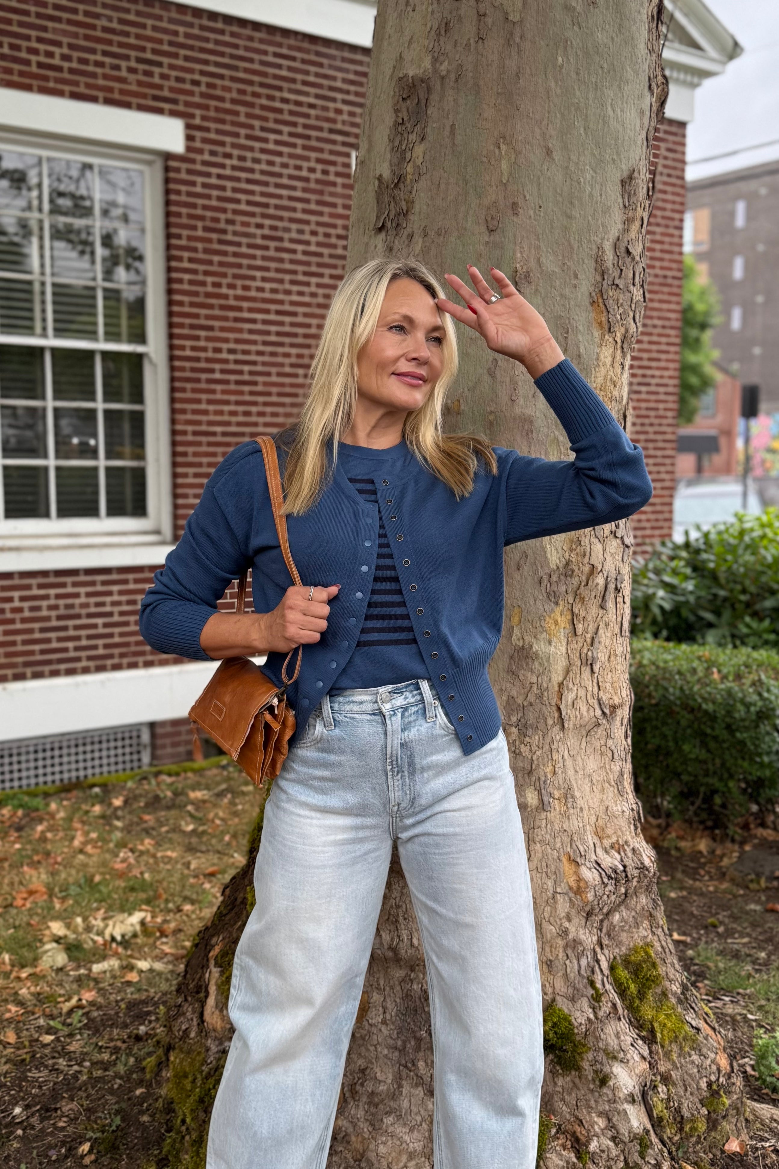 Meet your new layering MVP: the Snap It Up Pure Cotton Cardigan. Made from breathable midweight cotton with an easy fit, this versatile cardi is designed to go the distance -- wear it snapped all the way, open over a tee, or partially closed for a modern twist. A clean round neck, long sleeves, and dropped shoulders lend it a relaxed feel, while the hip-length hem keeps it polished. Finished with subtle snap closures, it pairs effortlessly with other Pure Cotton styles. 