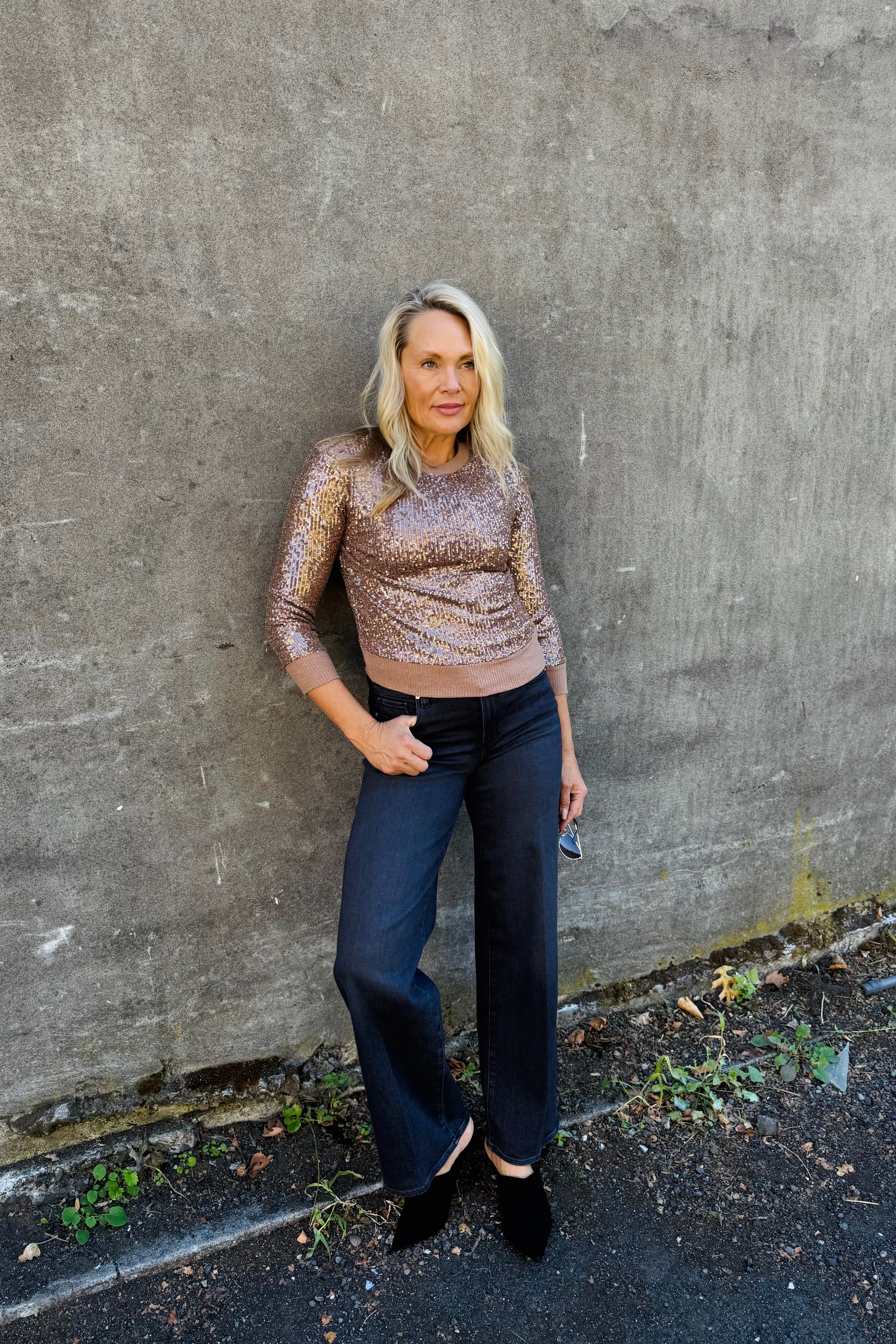 This sequined top boasts a crew neckline, long sleeves, and ribbed edges at the hem and cuffs. It features a relaxed silhouette with pull-on convenience for effortless styling.

Sequin Top
Crew Neck&nbsp;
Long Sleeve

Ribbed Hemline and Cuff&nbsp;
Pull On
Relaxed Fit