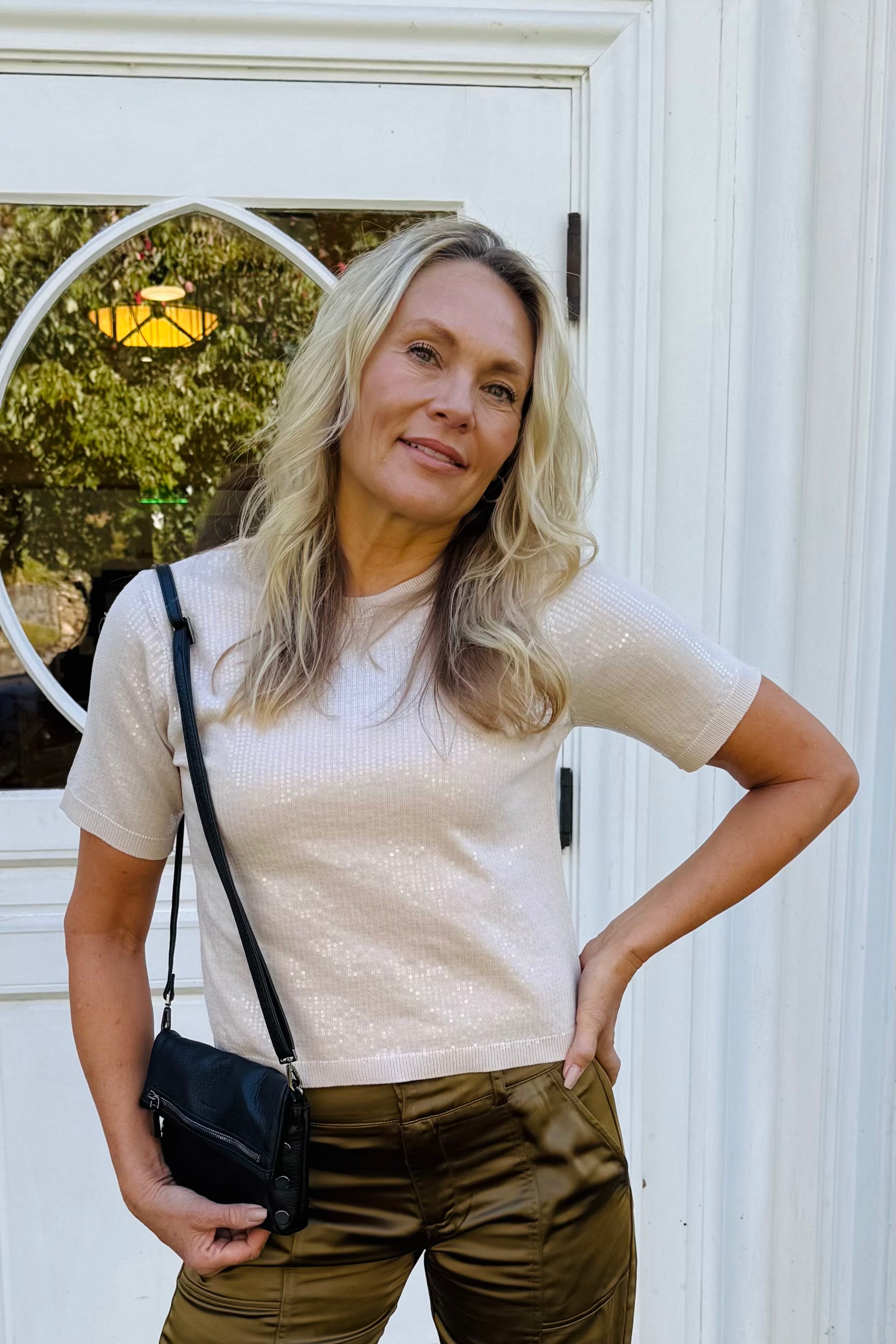 This sweater features a crew neckline, short sleeves, ribbed cuffs, and a pull-on style, all adorned with sparkling sequins for a refined, stylish look.

Sequin Sweater Top
Crew Neck&nbsp;
Short Sleeve

Ribbed Cuff
Pull On
Relaxed Fit