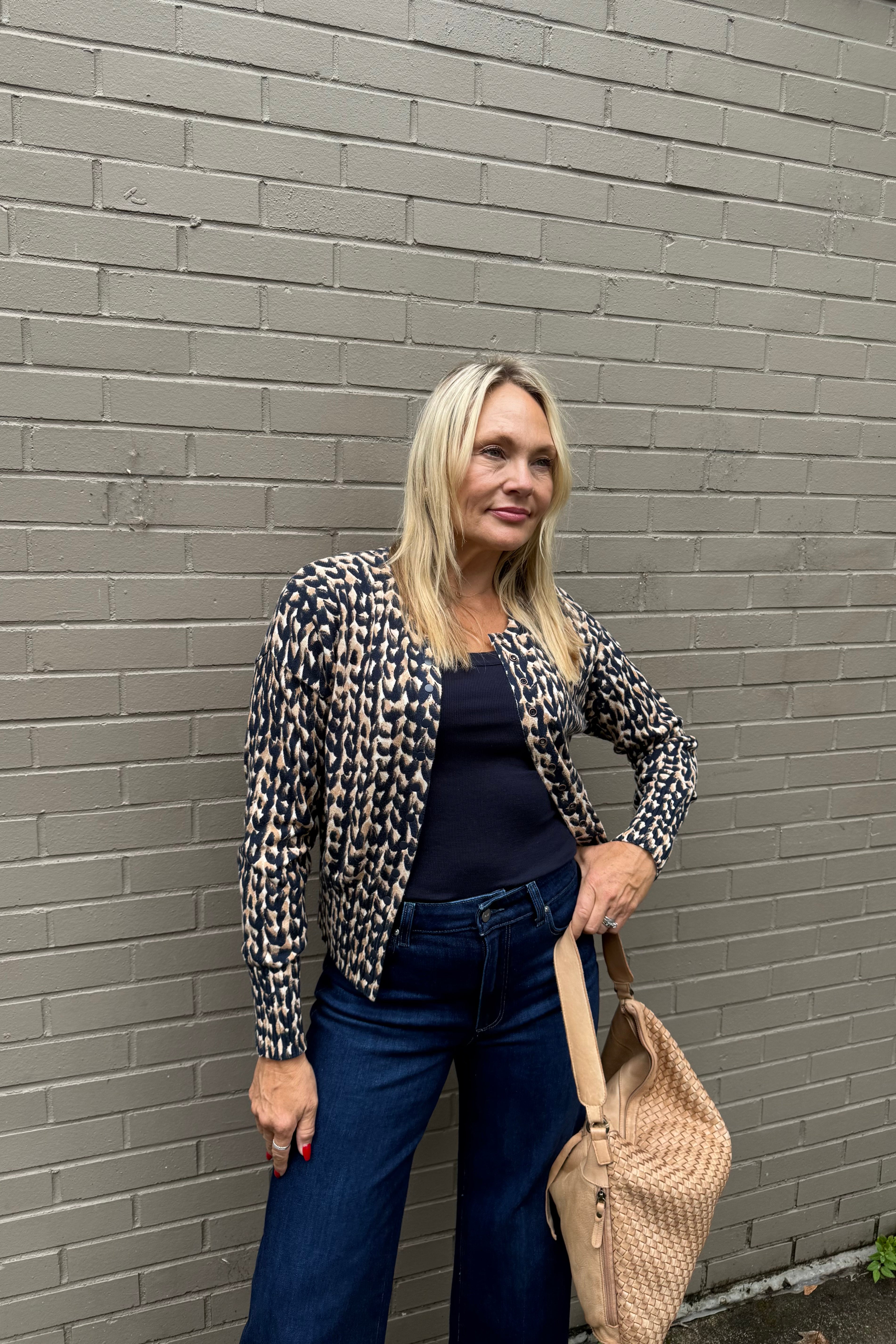 Meet your new layering MVP: the Snap It Up Pure Cotton Cardigan in our eye-catching, high contrast Stitch print. Made from breathable midweight cotton with an easy fit, this versatile cardi is designed to go the distance -- wear it snapped all the way, open over a tee, or partially closed for a modern twist. A clean round neck, long sleeves, and dropped shoulders lend it a relaxed feel, while the hip-length hem keeps it polished. 