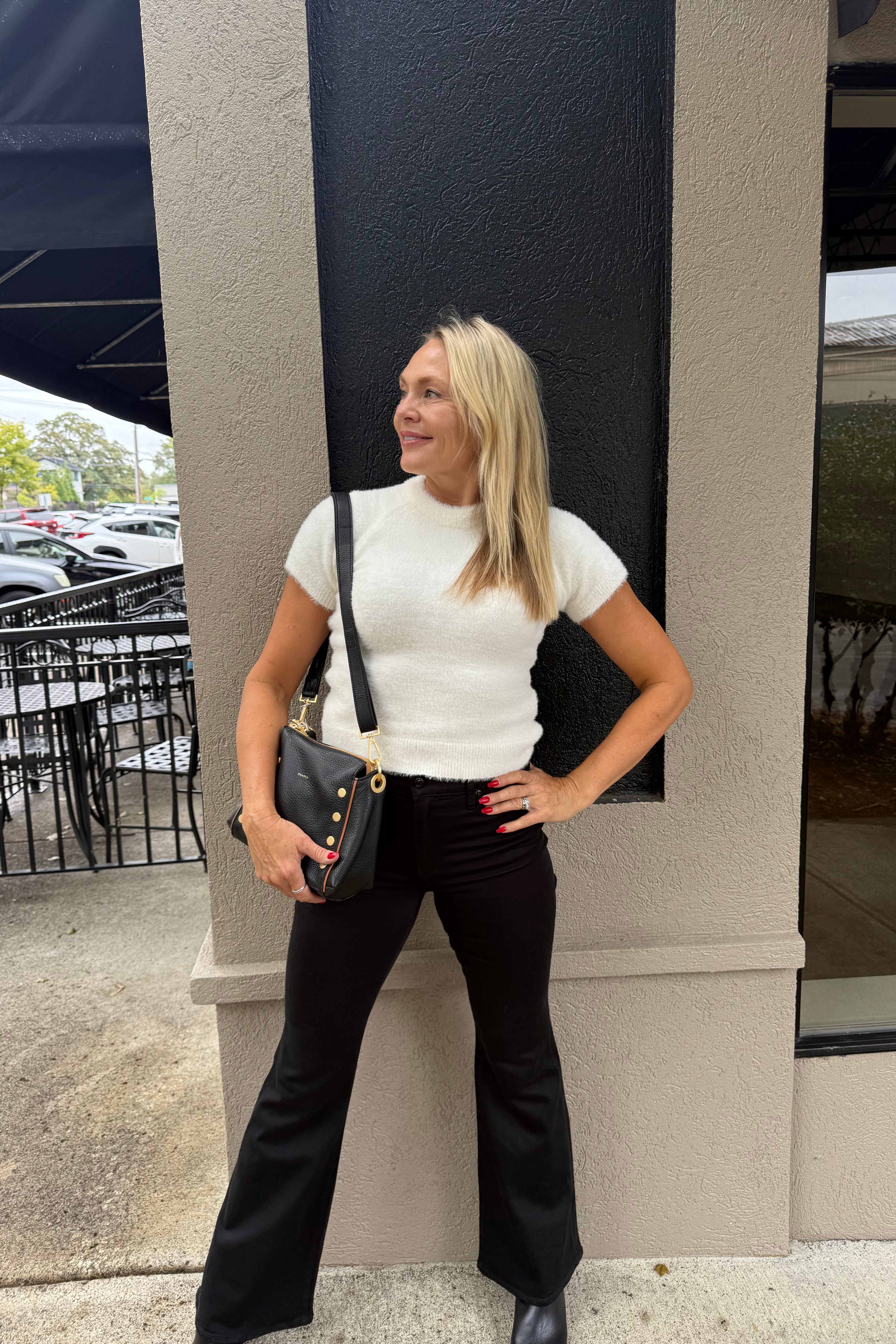 Experience unmatched softness with this teddy sweater. Designed in a tee style featuring a mock neck, it offers an ideal length for a polished look. This sweater promises comfort and style in one perfect piece.