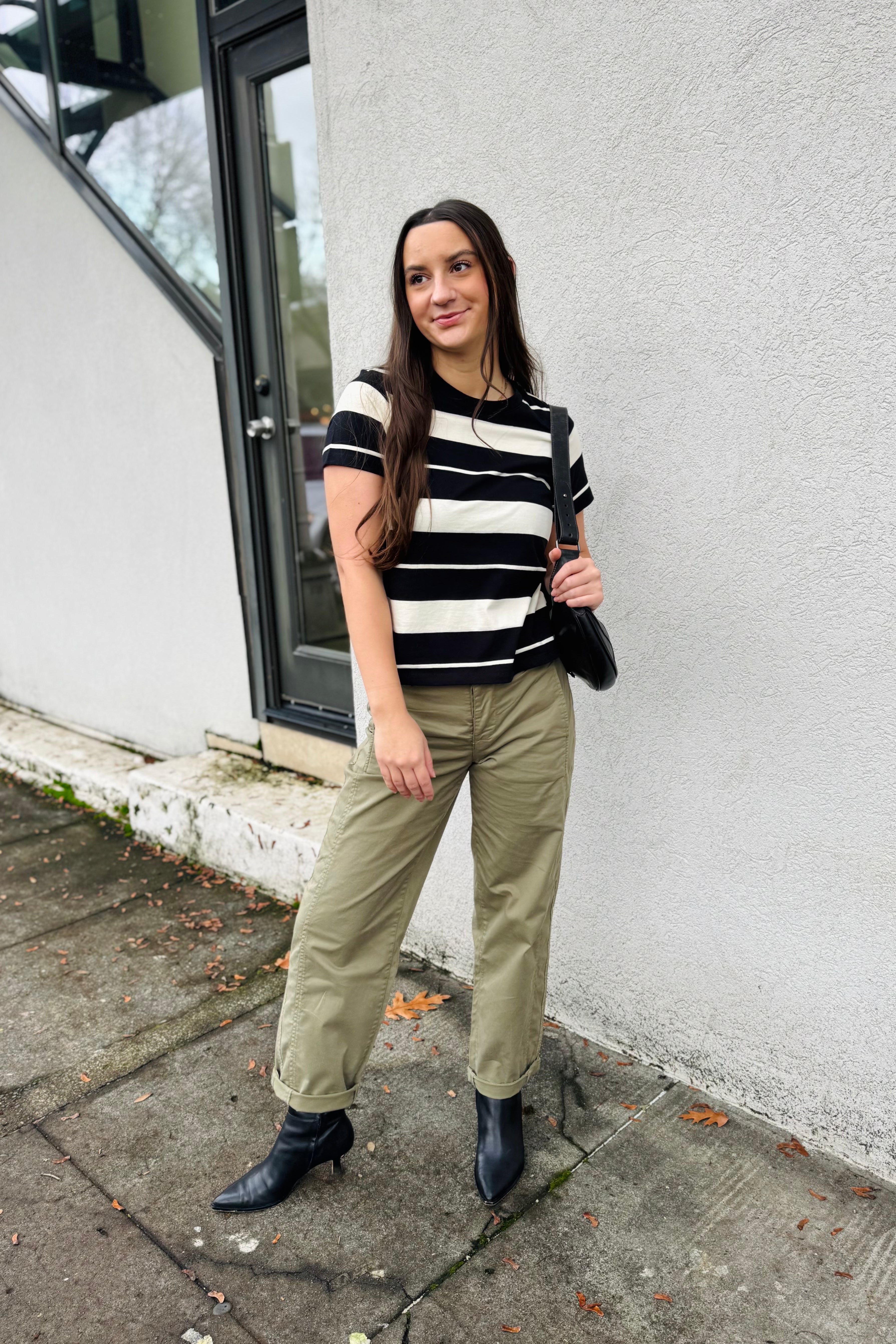 Elevate your everyday wardrobe with this versatile essential. The classic vanilla and black stripe pattern pairs seamlessly with virtually any ensemble, whether worn solo for understated sophistication or layered beneath outerwear for added dimension. Crafted with a refined crew neck and short sleeves, this piece delivers both style and practicality for the discerning dresser.