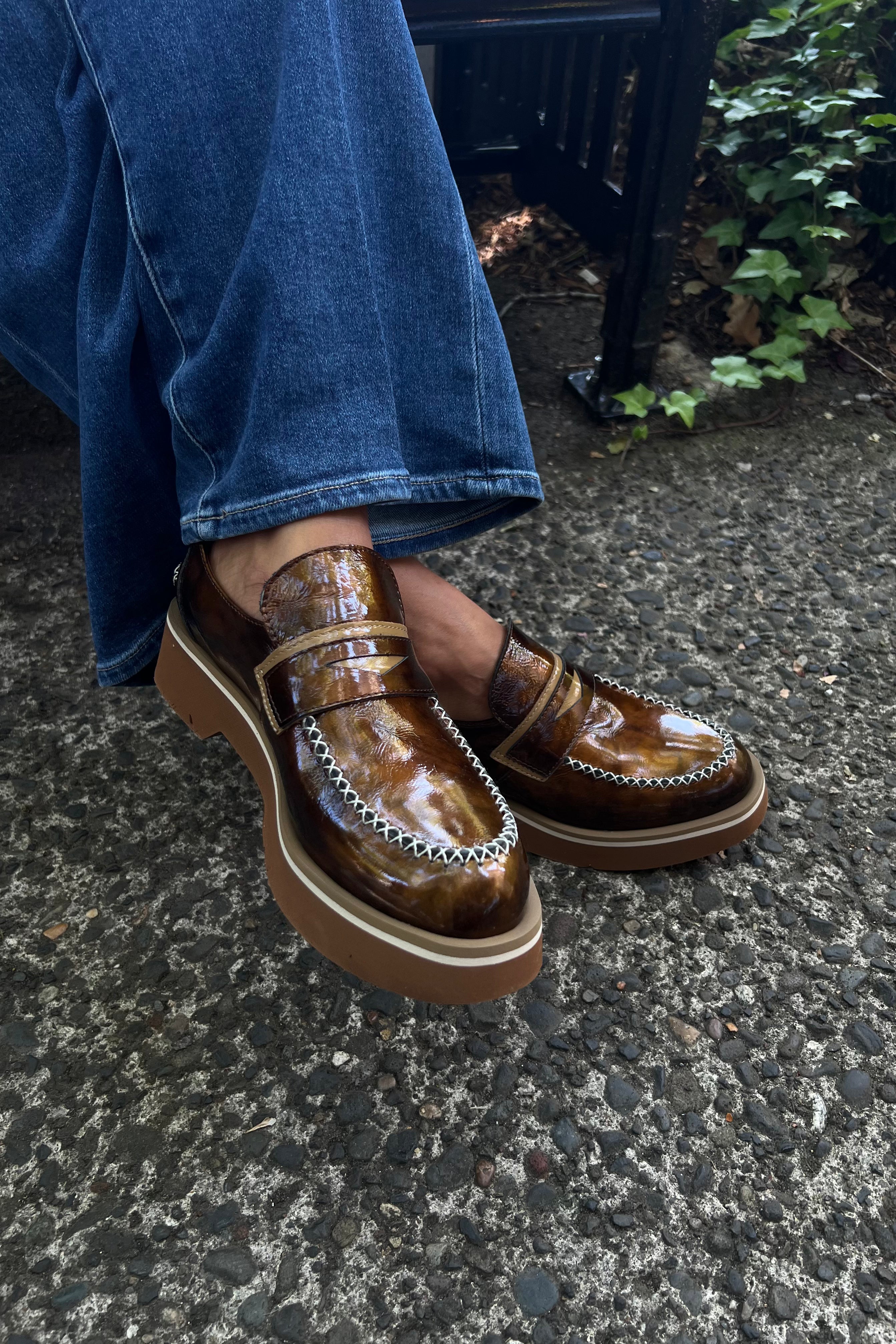 The Vanda - Brown loafer offers a sophisticated twist on a classic style, combining earthy tones with a luxurious finish. Its chunky sole adds modern durability and comfort, making it perfect for women who seek a harmonious blend of effortless casual wear and refined elegance. Ideal for those who prioritize style without sacrificing comfort.