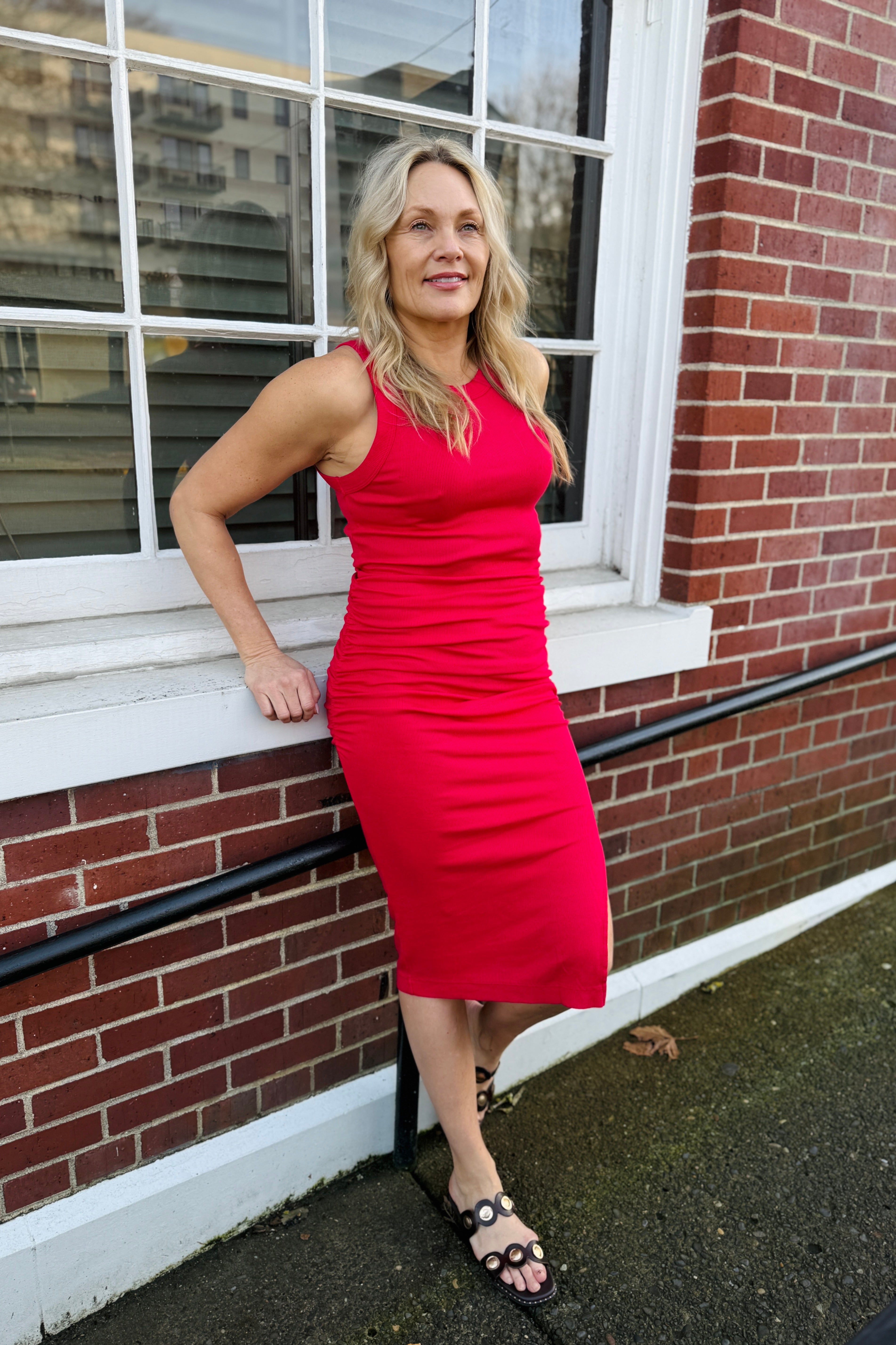 A form-fitting, tank dress with a side slit a the hem, Wren features a crew neck, midi length, and ruching on the sides at the waist to hug and flatter every curve. Made from our soft Ultra Rib fabric that washes well and keeps it's shape throughout wearings