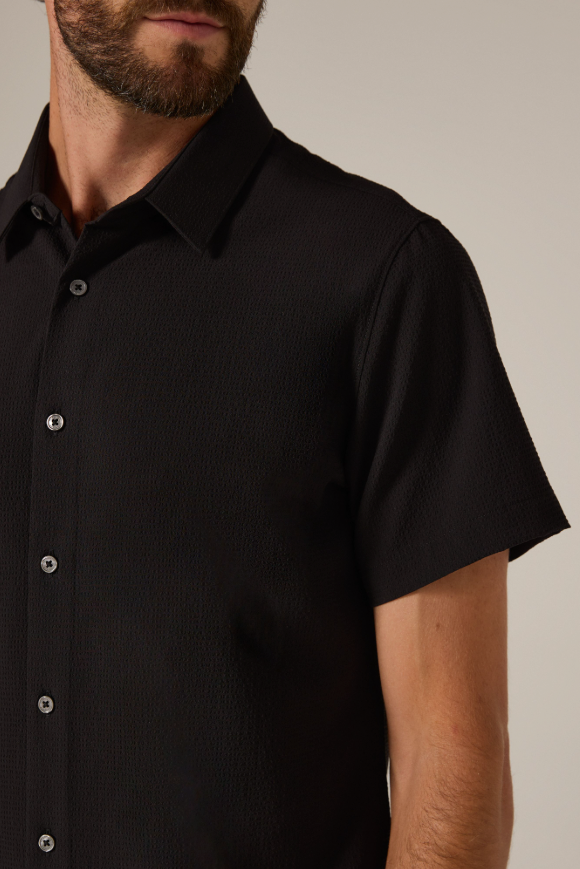 7 Diamonds Barnes shirt in Black, a breathable seersucker-style button-up that keeps you cool and sharp on hot days at the office, summer weddings, vacations and nights out